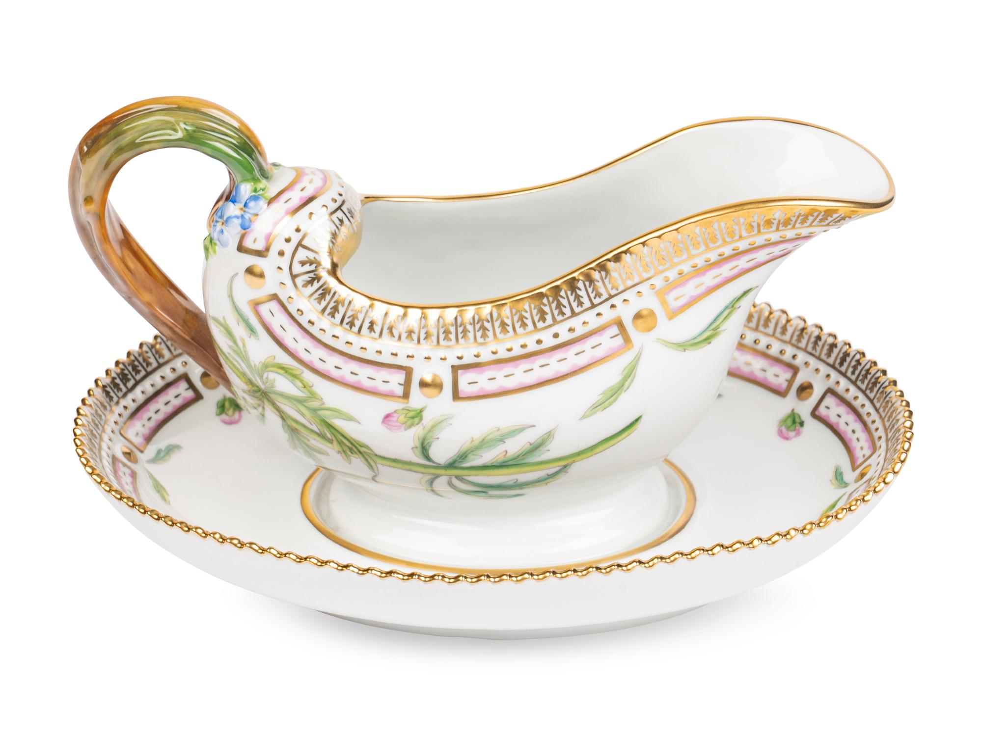 A Royal Copenhagen Flora Danica Porcelain Sauce Boat and Fixed Stand