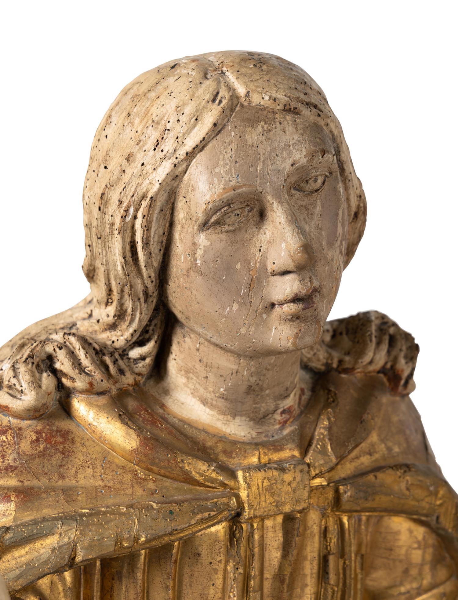 A Continental Painted and Parcel Giltwood Figure