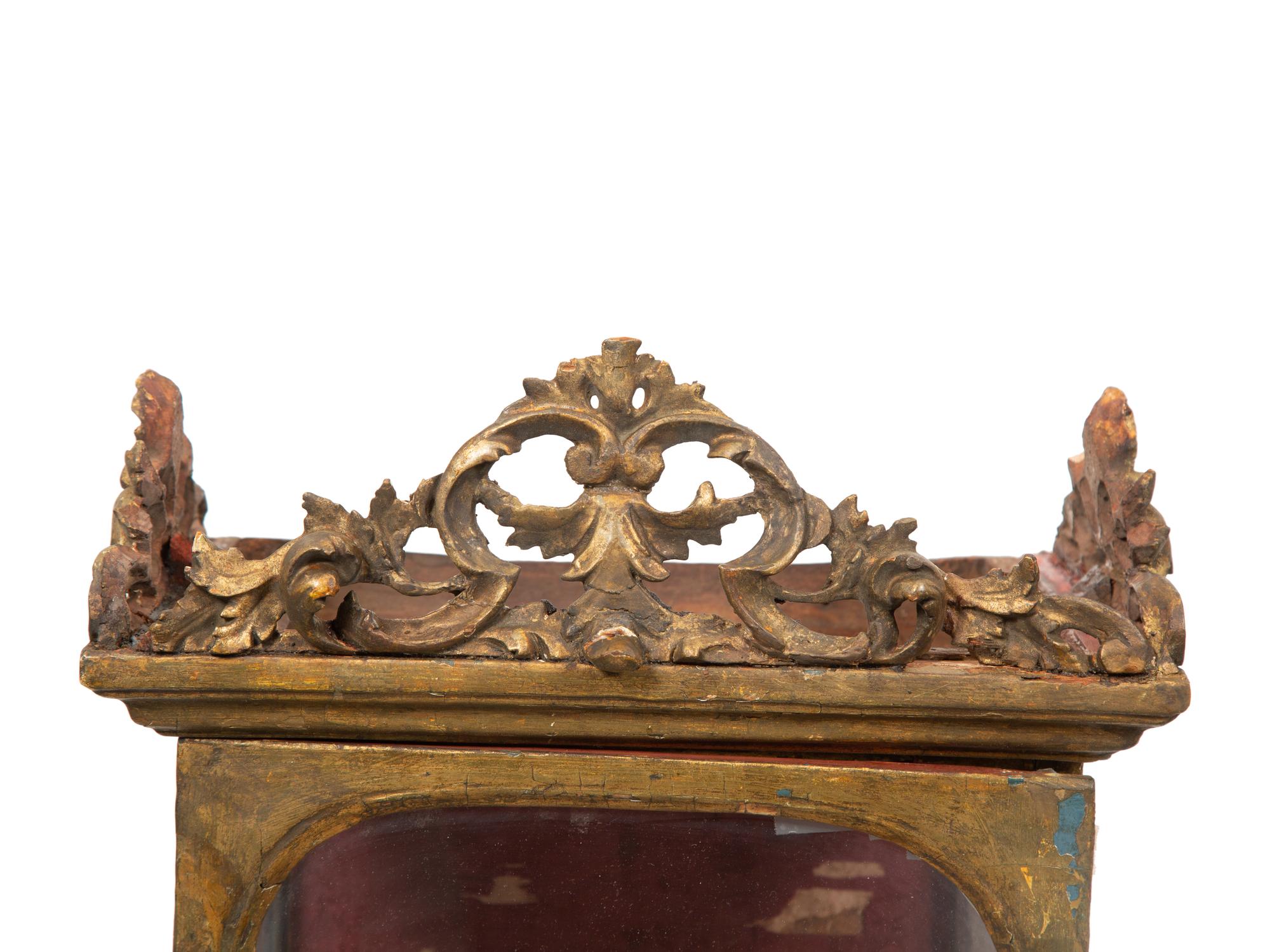 An Italian Carved Giltwood Reliquary Cabinet
