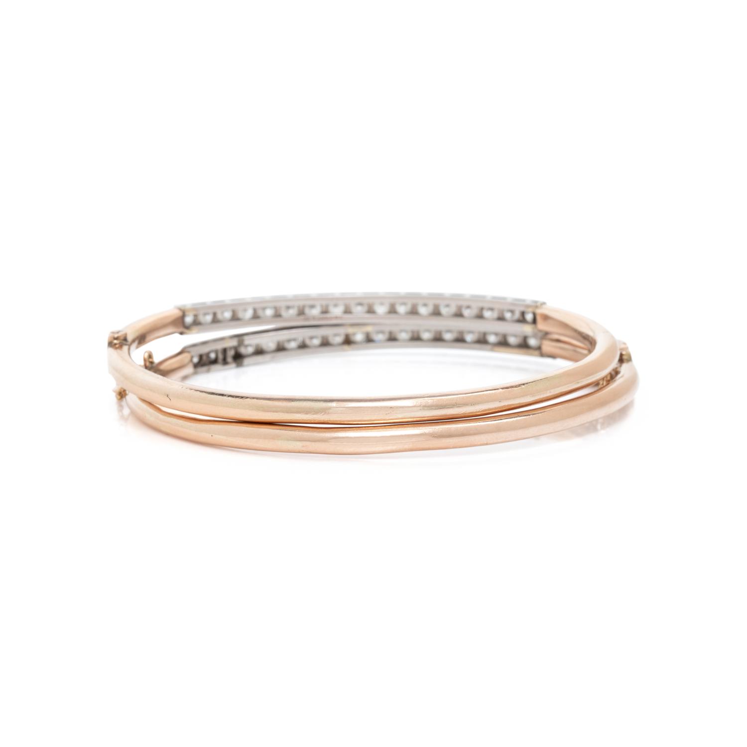 A PAIR OF ROSE GOLD AND DIAMOND BANGLE BRACELETS