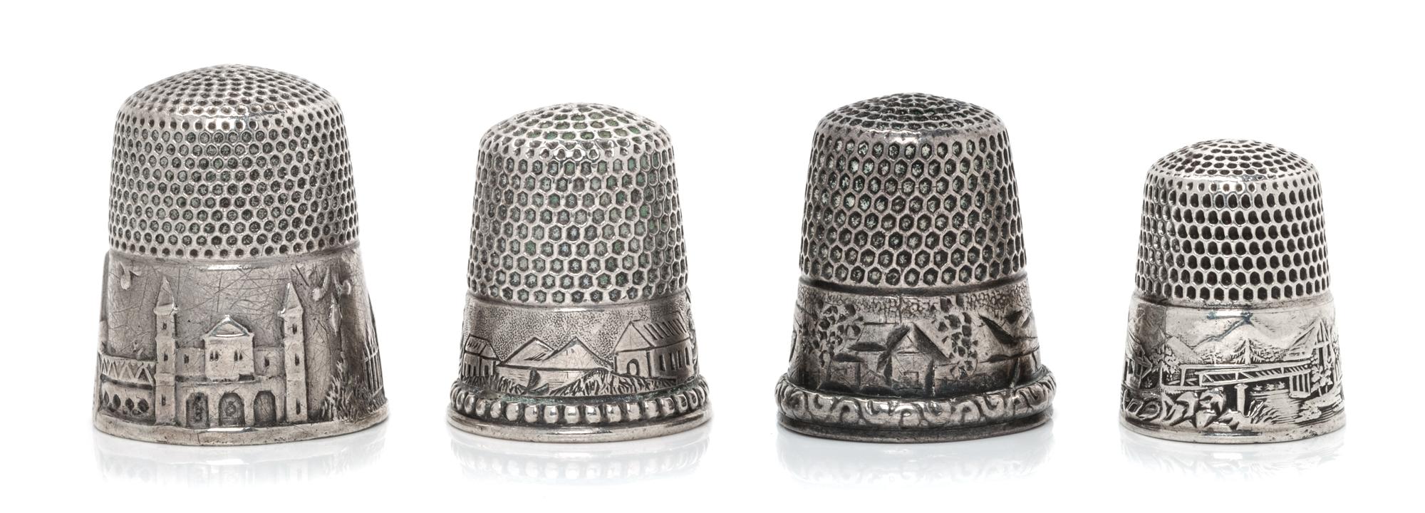Four American Silver 'Scenic' Thimbles, Various Makers, each having a knurled top and body above a band worked to show village scenes,