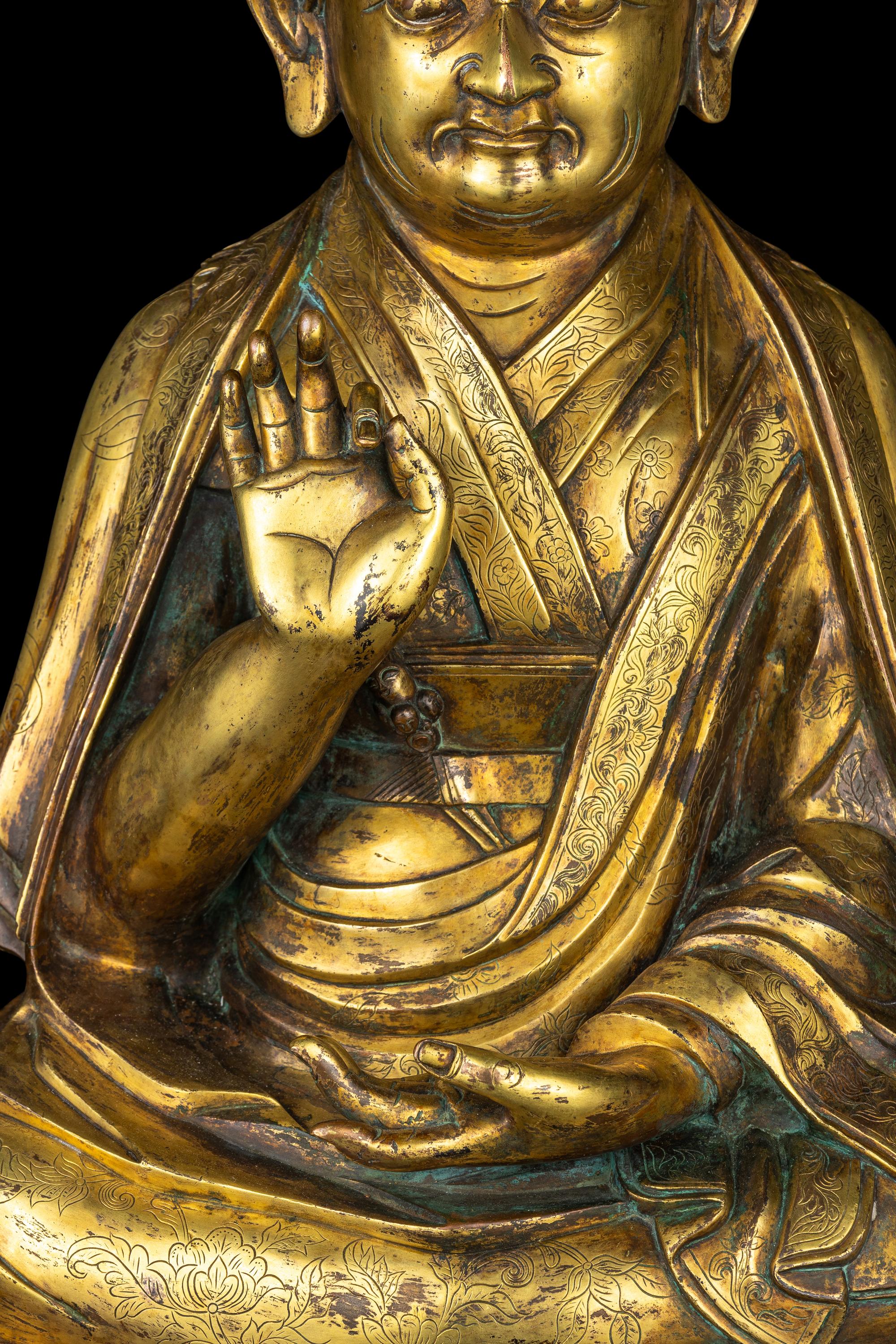 A Large Sino-Tibetan Gilt Bronze Figure of a Lama 巨型銅鎏金上師坐像