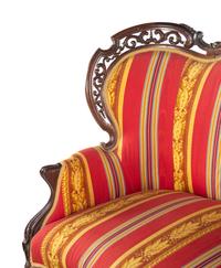 A Renaissance Revival Laminated and Carved Rosewood Three-Piece Parlor Suite