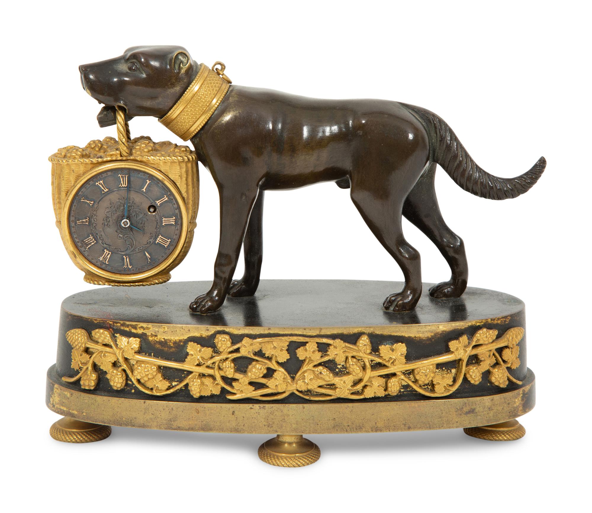 A Small French Gilt and Patinated Bronze Dog Clock
