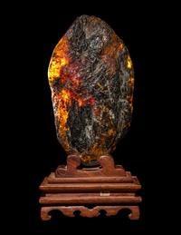 A Chinese Carved Amber Carving of Guanyin