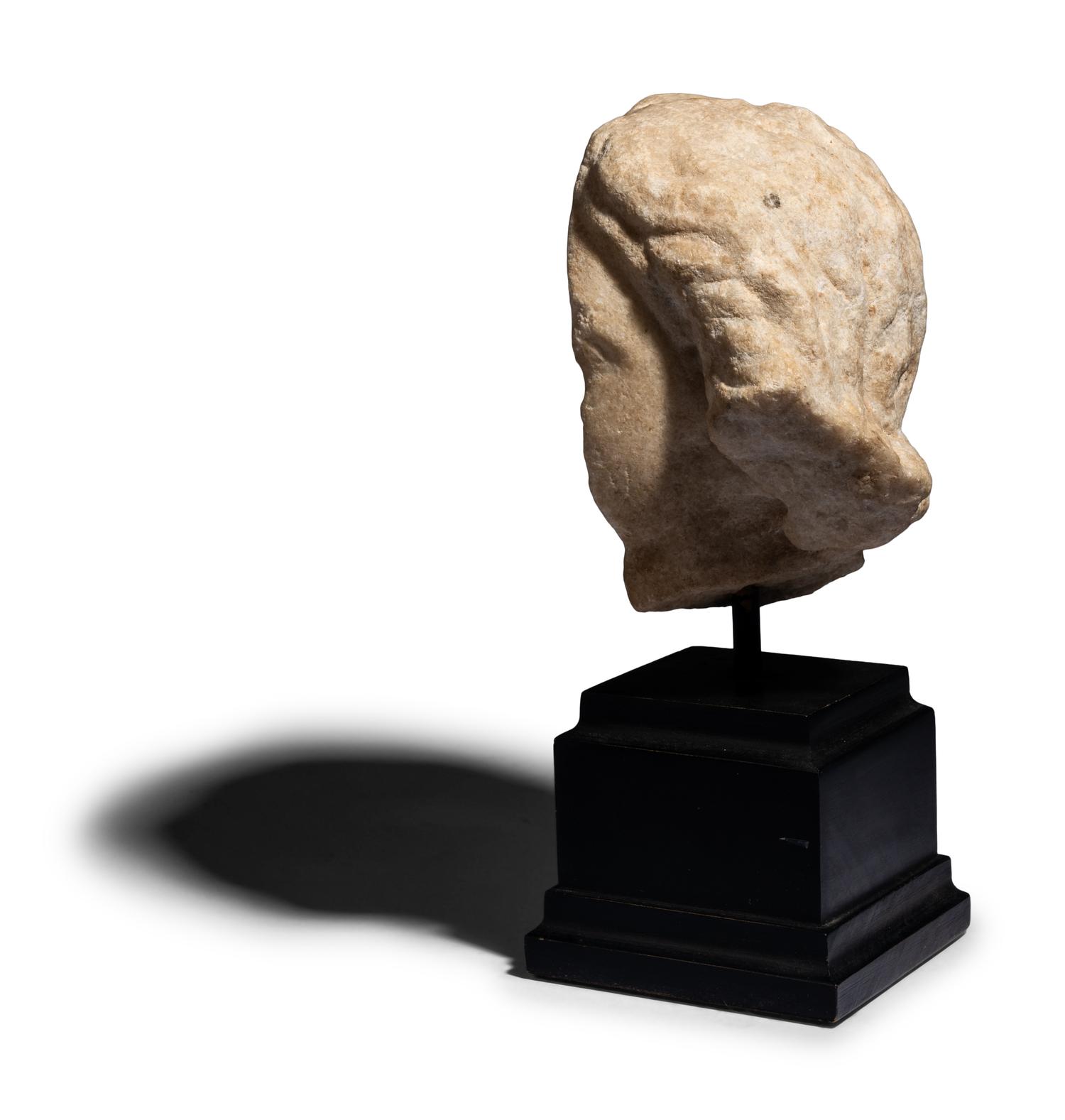 A Roman Marble Fragmentary Head of a Female