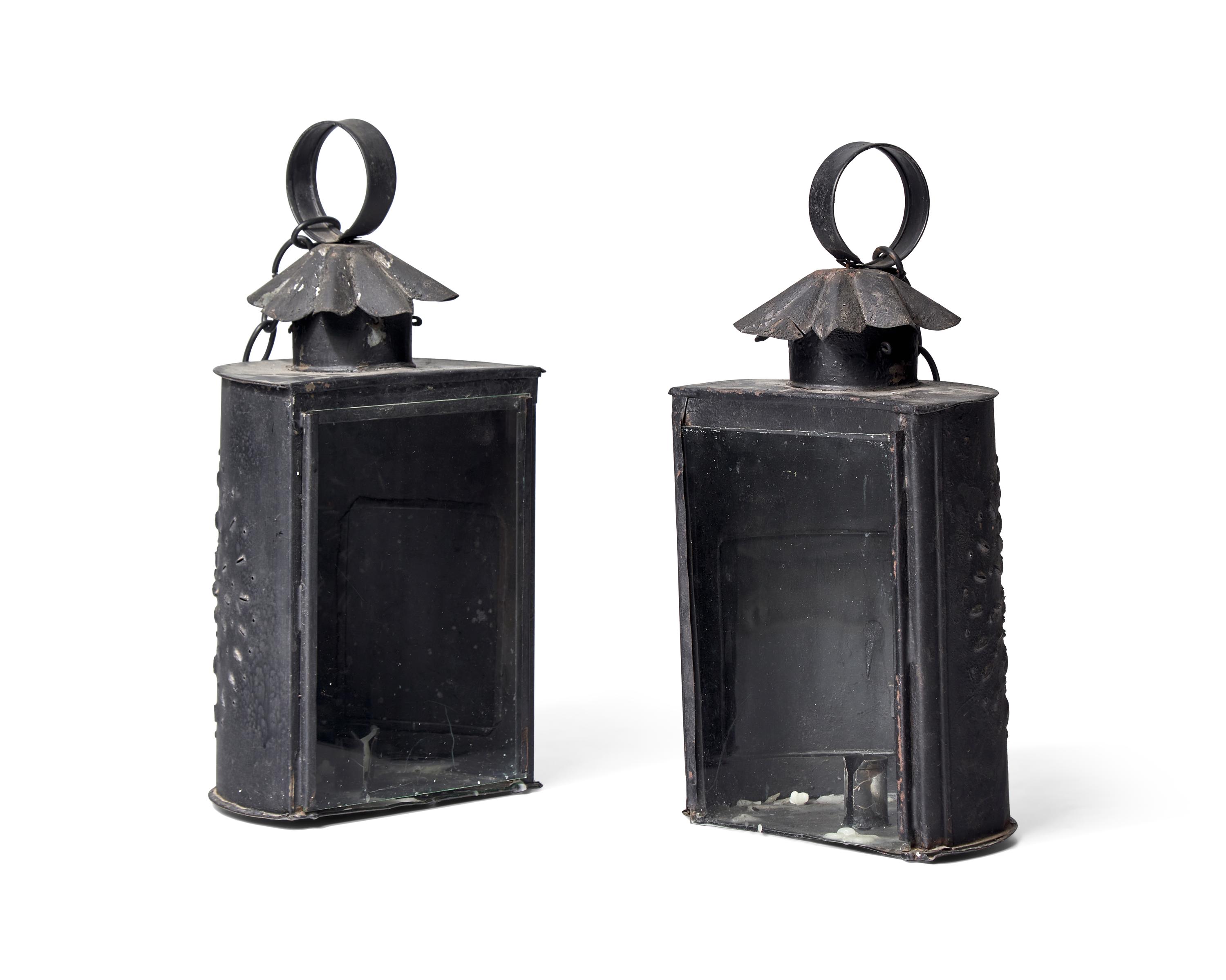 A Pair of Hanging Pierced Tinware and Glass Lanterns