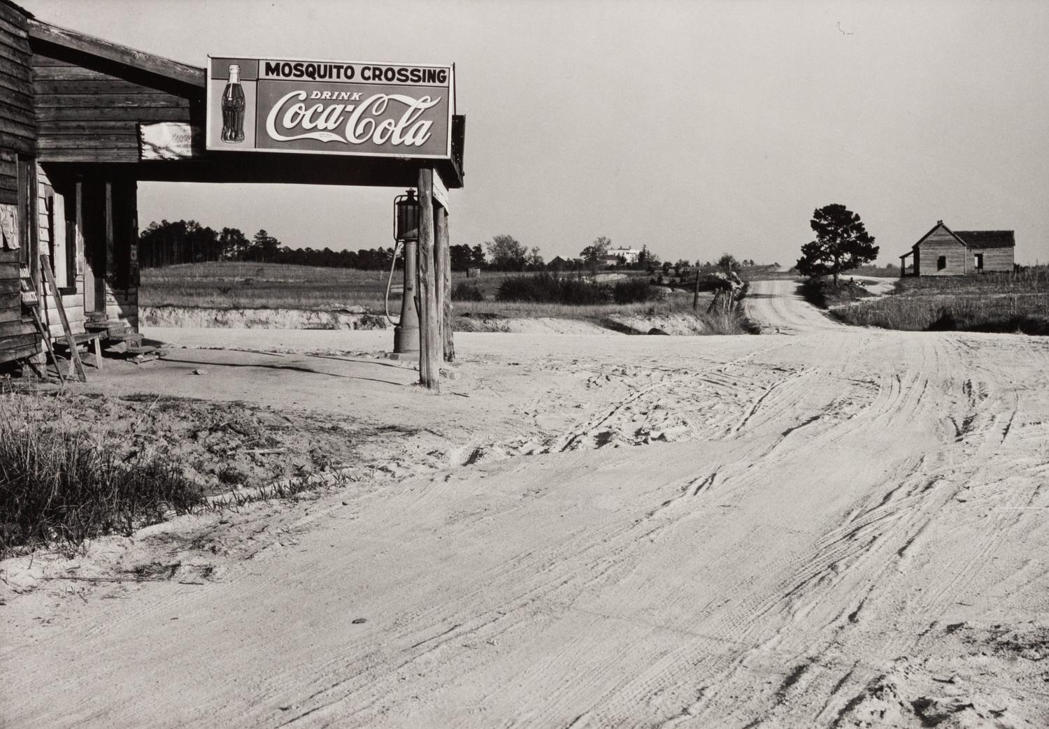 A group of five photographs ( A member of the Wilkins Family Making Biscuits , 1939; Post Office in Blizzard, Aspen, CO , 1941; Negro (Black) Man Entering Movie Theater by Colored Entrance, Belzoni, Miss., 1939; Crossroad and General Store (Mosquito Crossing) Near Greensboro, GA, 1939 (printed 1981); Recreation Evening at Community School Under Direction of WPA Recreational Supervisor (in suit and tie) Coffee County, Alabama, 1939)