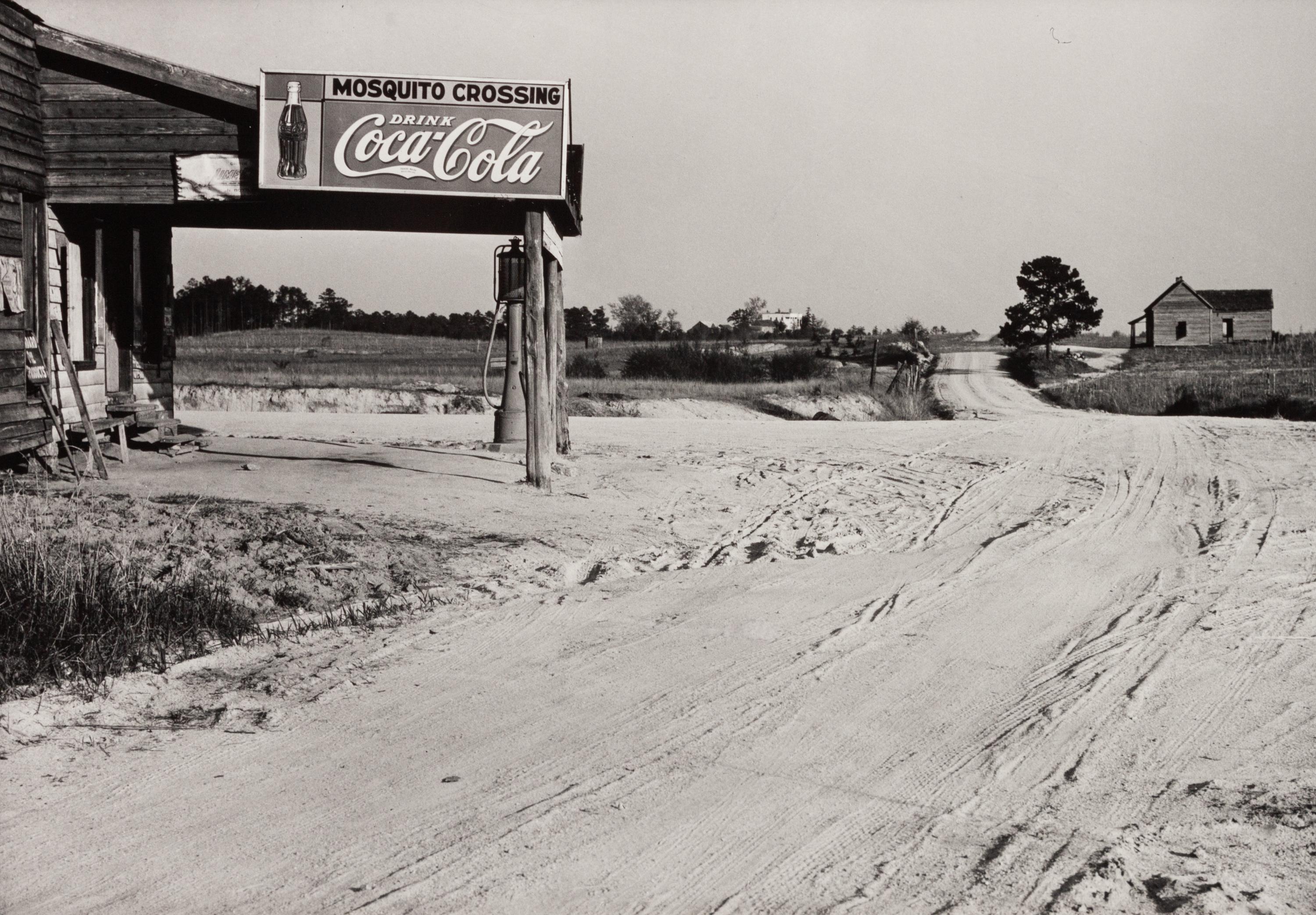 A group of five photographs ( A member of the Wilkins Family Making Biscuits , 1939; Post Office in Blizzard, Aspen, CO , 1941; Negro (Black) Man Entering Movie Theater by Colored Entrance, Belzoni, Miss., 1939; Crossroad and General Store (Mosquito Crossing) Near Greensboro, GA, 1939 (printed 1981); Recreation Evening at Community School Under Direction of WPA Recreational Supervisor (in suit and tie) Coffee County, Alabama, 1939)