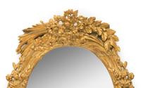 A Large Continental Giltwood Oval Mirror