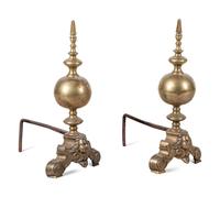 A Pair of Continental Brass Andirons with Masks