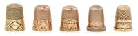 Five American Gold Thimbles, Various Makers, comprising an example with a bi-color gold band to the base, Stern Bros., New York, NY; an