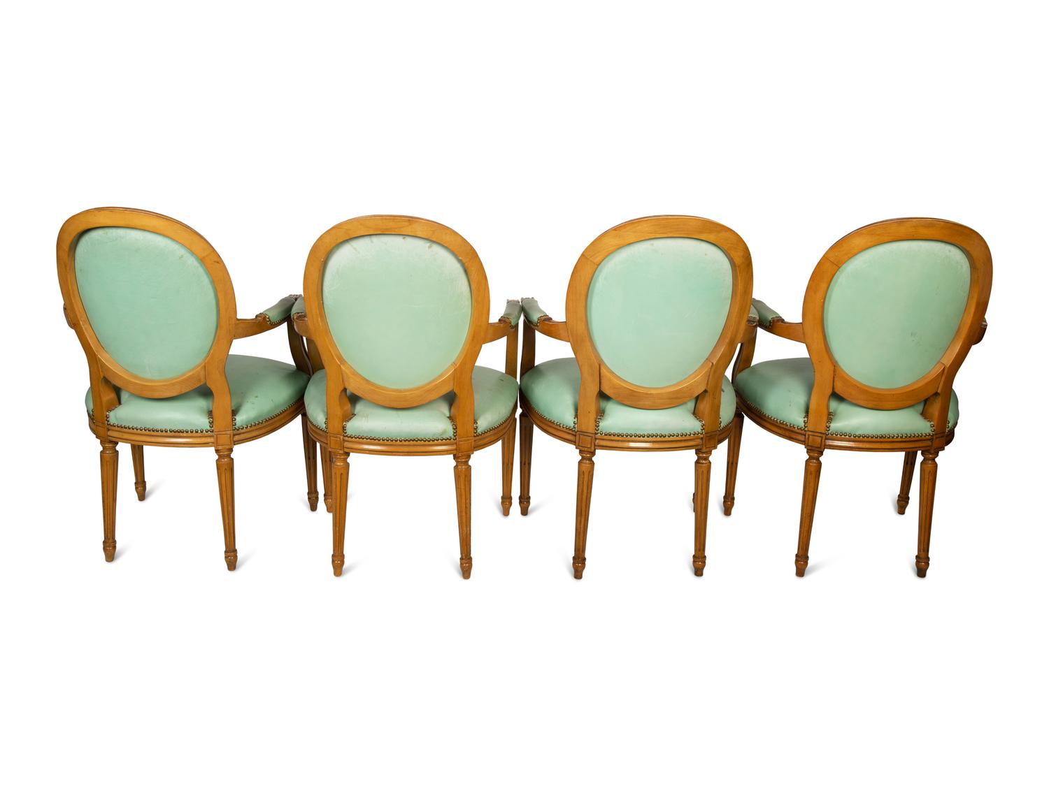 A Set of Four Louis XVI Style Leather-Upholstered Fauteuils