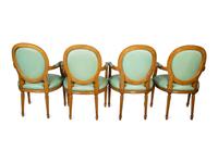 A Set of Four Louis XVI Style Leather-Upholstered Fauteuils