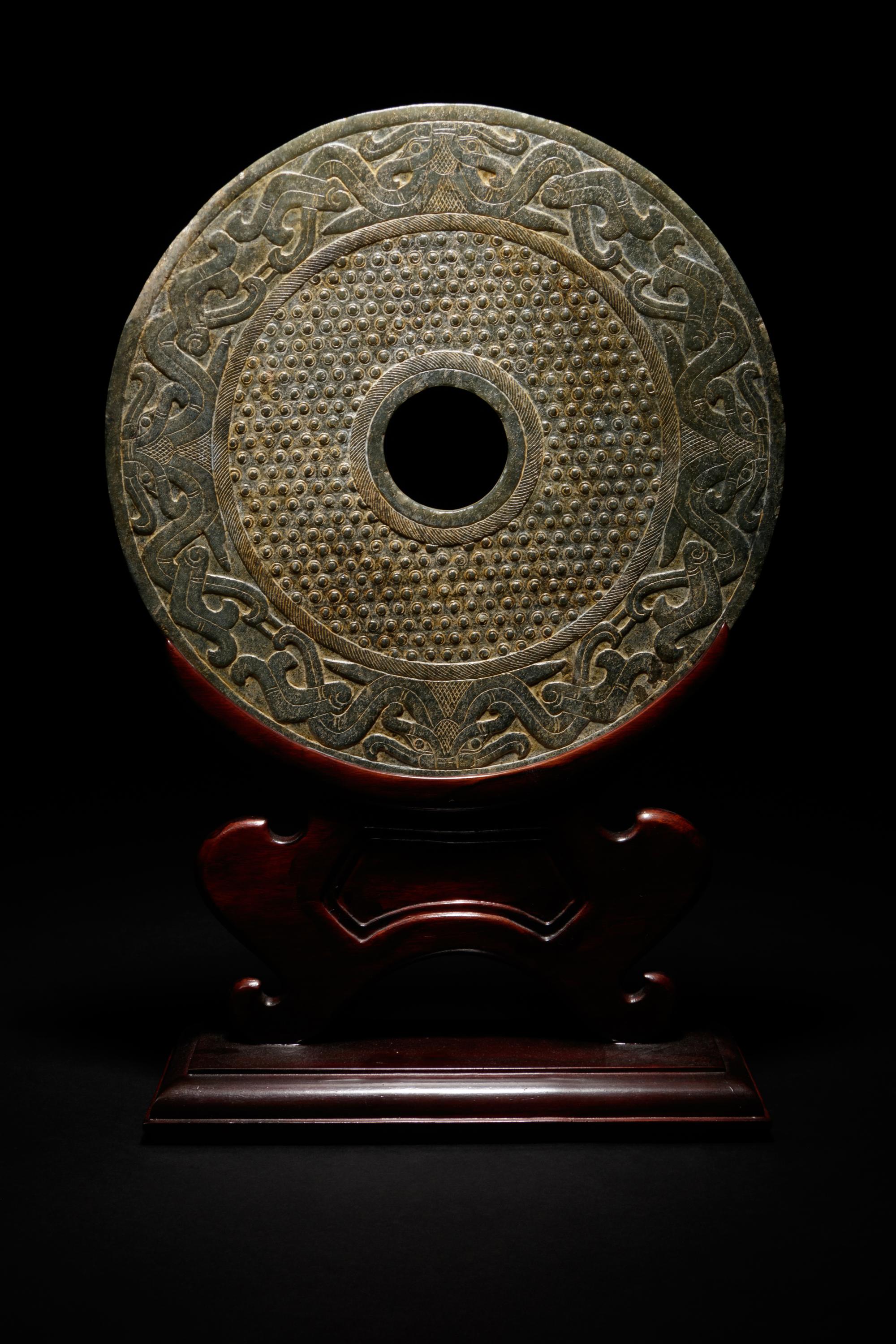 A Chinese Liangzhu-s tyle Carved Nephrite Jade Bi Disc