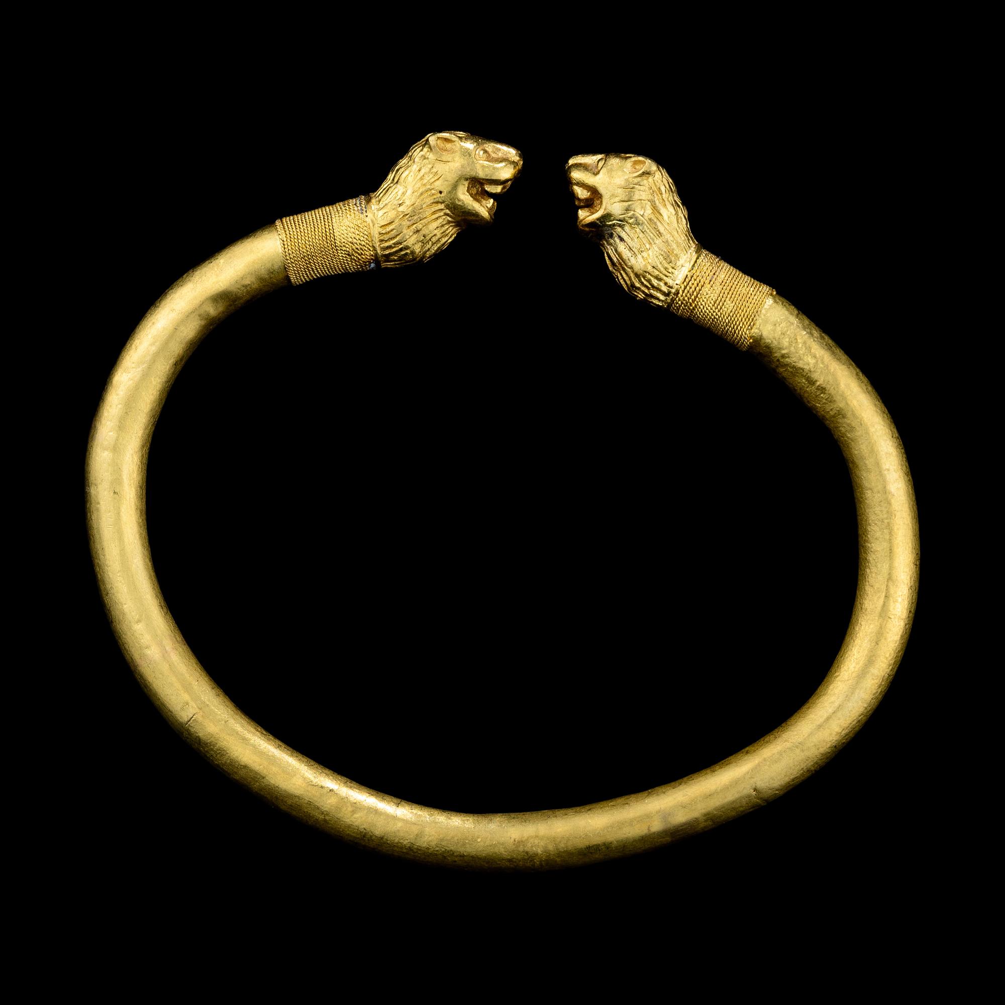 A Greek or Achaemenid Gold Bracelet with Lion Terminals