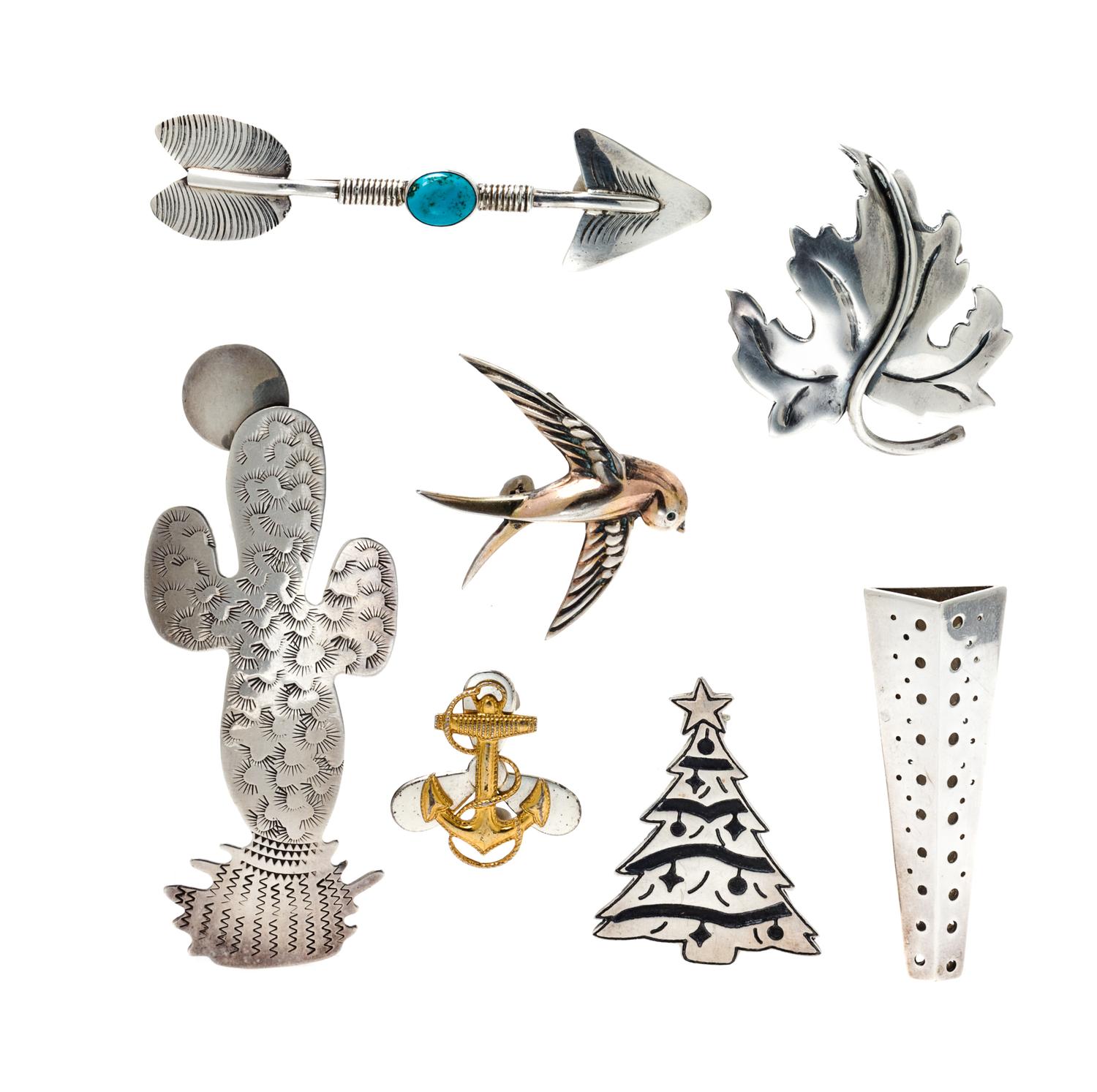 A Collection of Sterling Silver Brooches, 41.10 dwts.