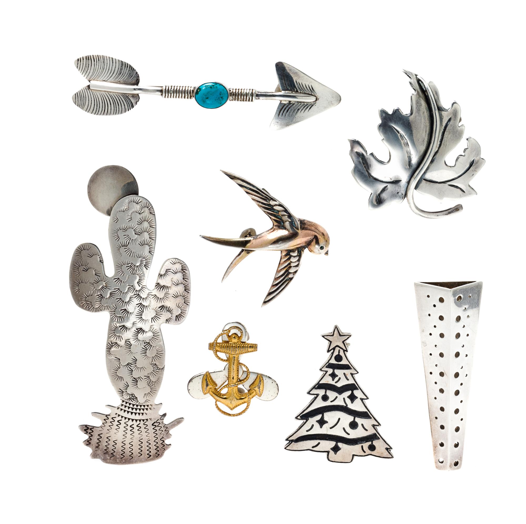 A Collection of Sterling Silver Brooches, 41.10 dwts.