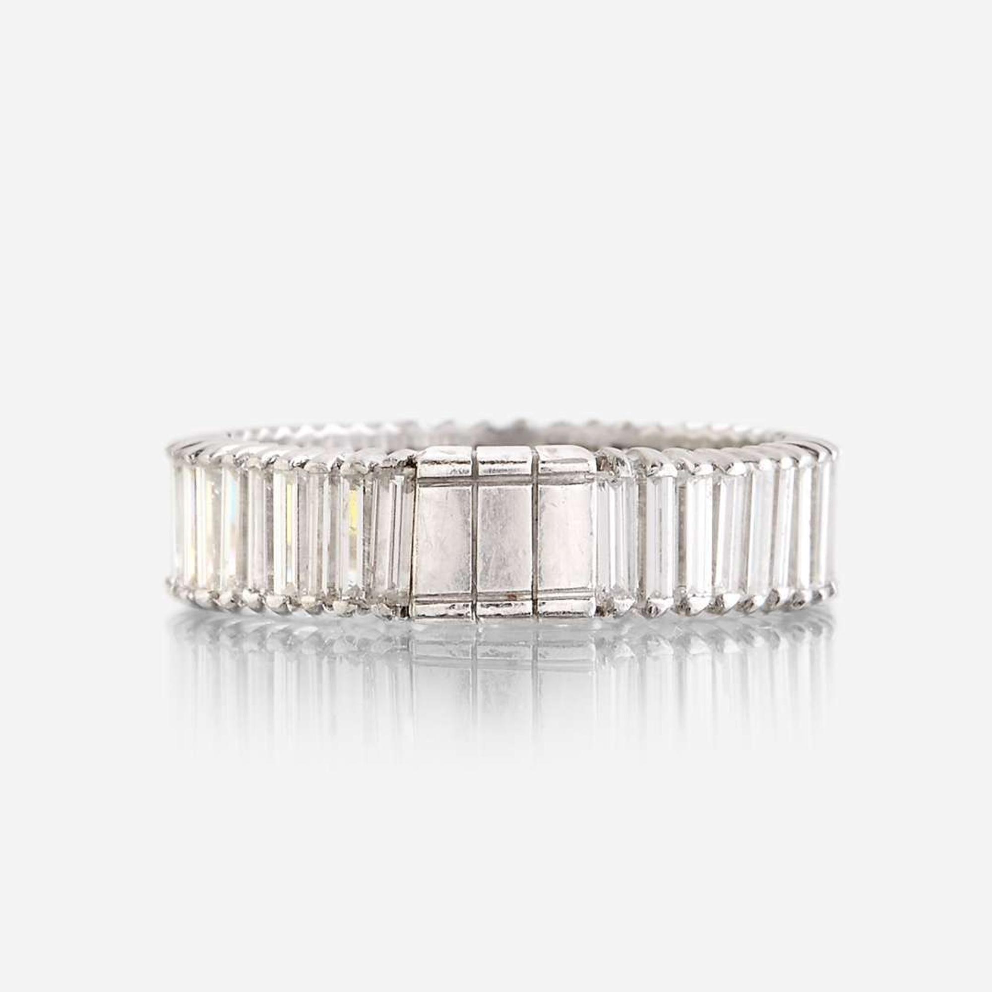 A diamond and eighteen karat white gold ring