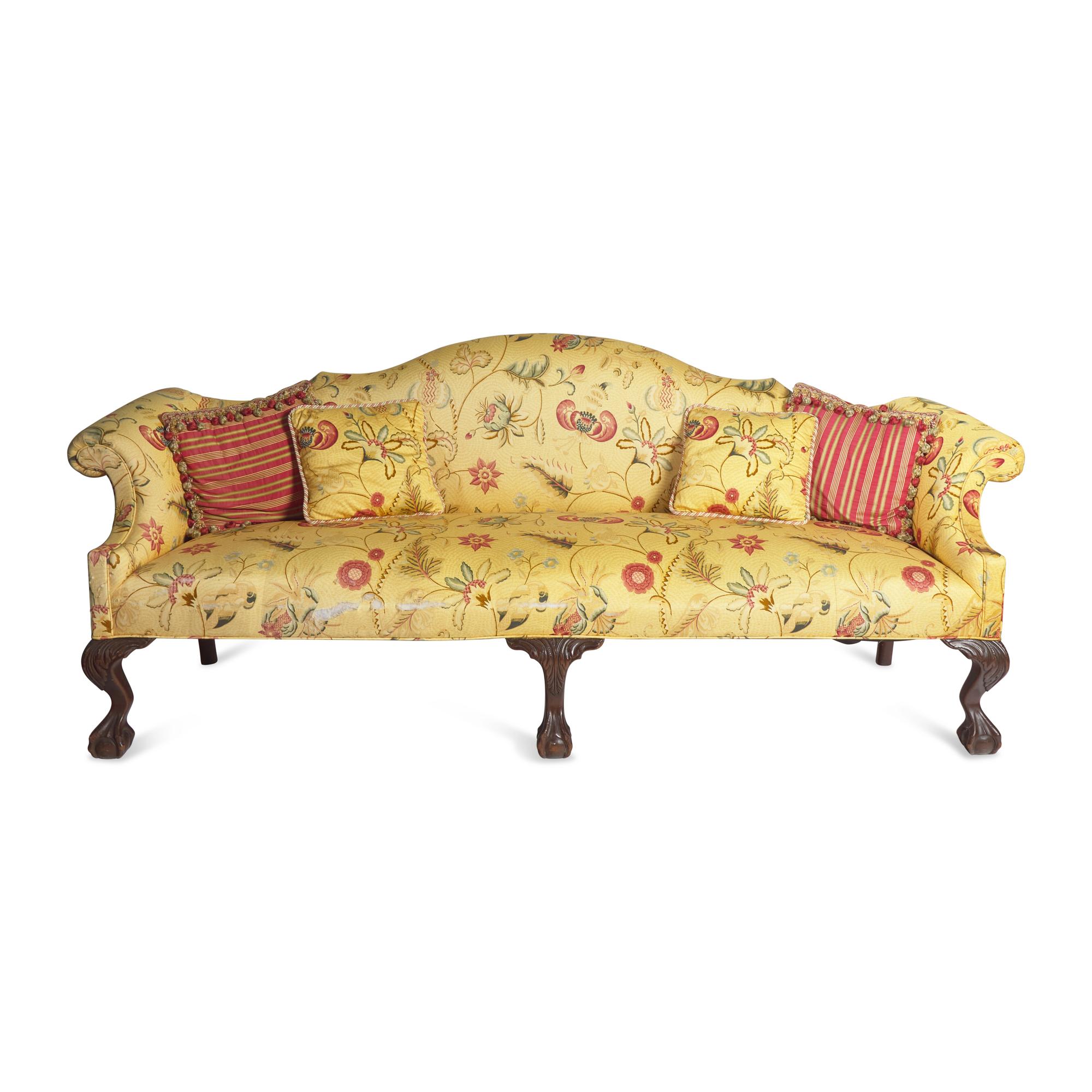 A Chippendale Style Carved Mahogany Camelback Sofa