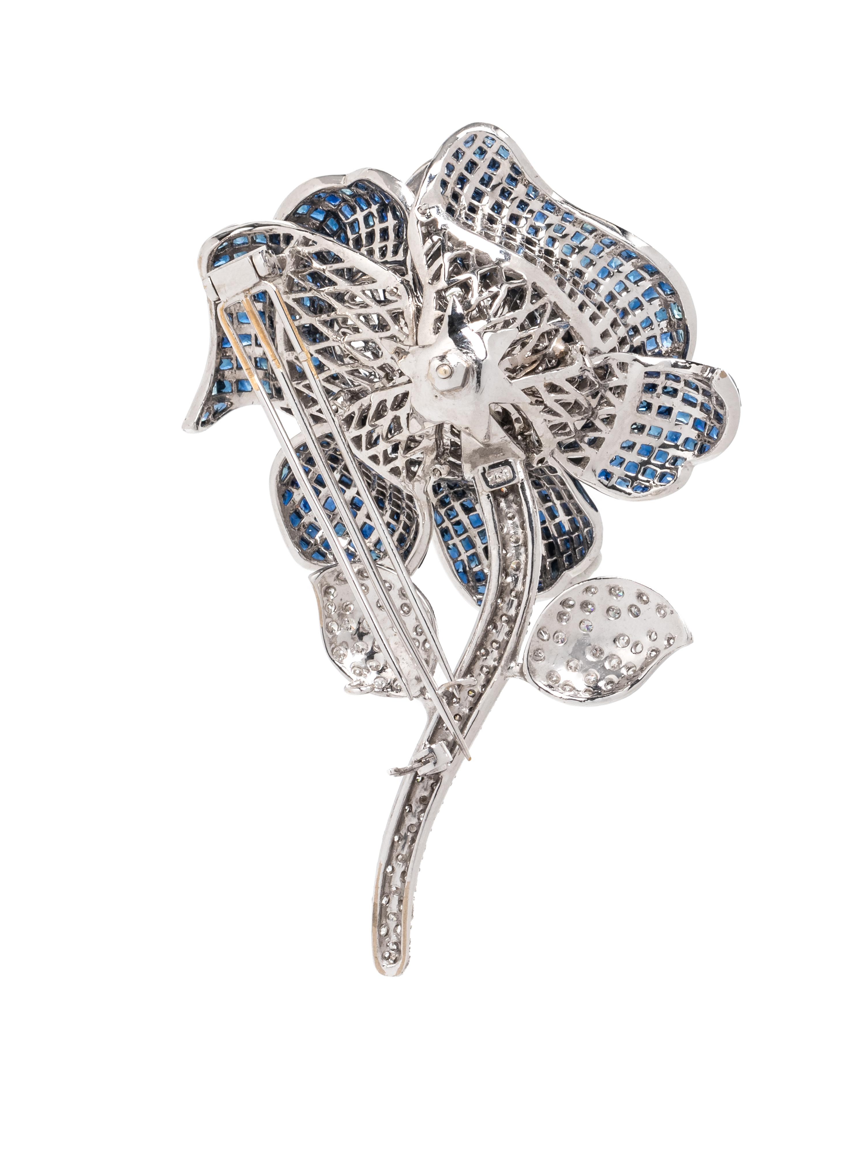 INVISIBLY-SET SAPPHIRE AND DIAMOND FLOWER BROOCH