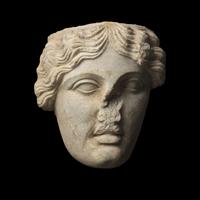 A Roman Marble Fragmentary Head of the Goddess Tyche-Fortuna