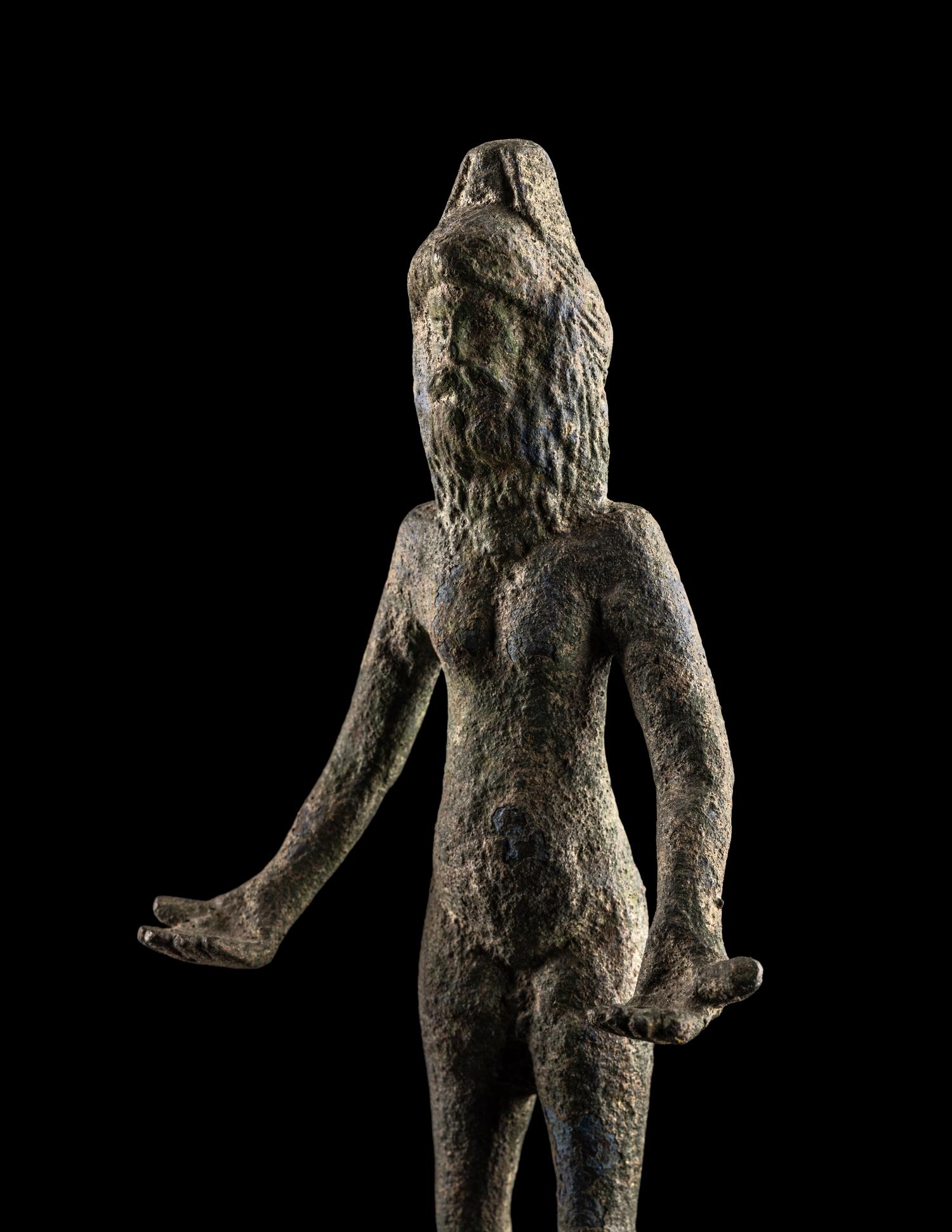 An Etruscan Bronze Female Figure Wearing a Theater Mask