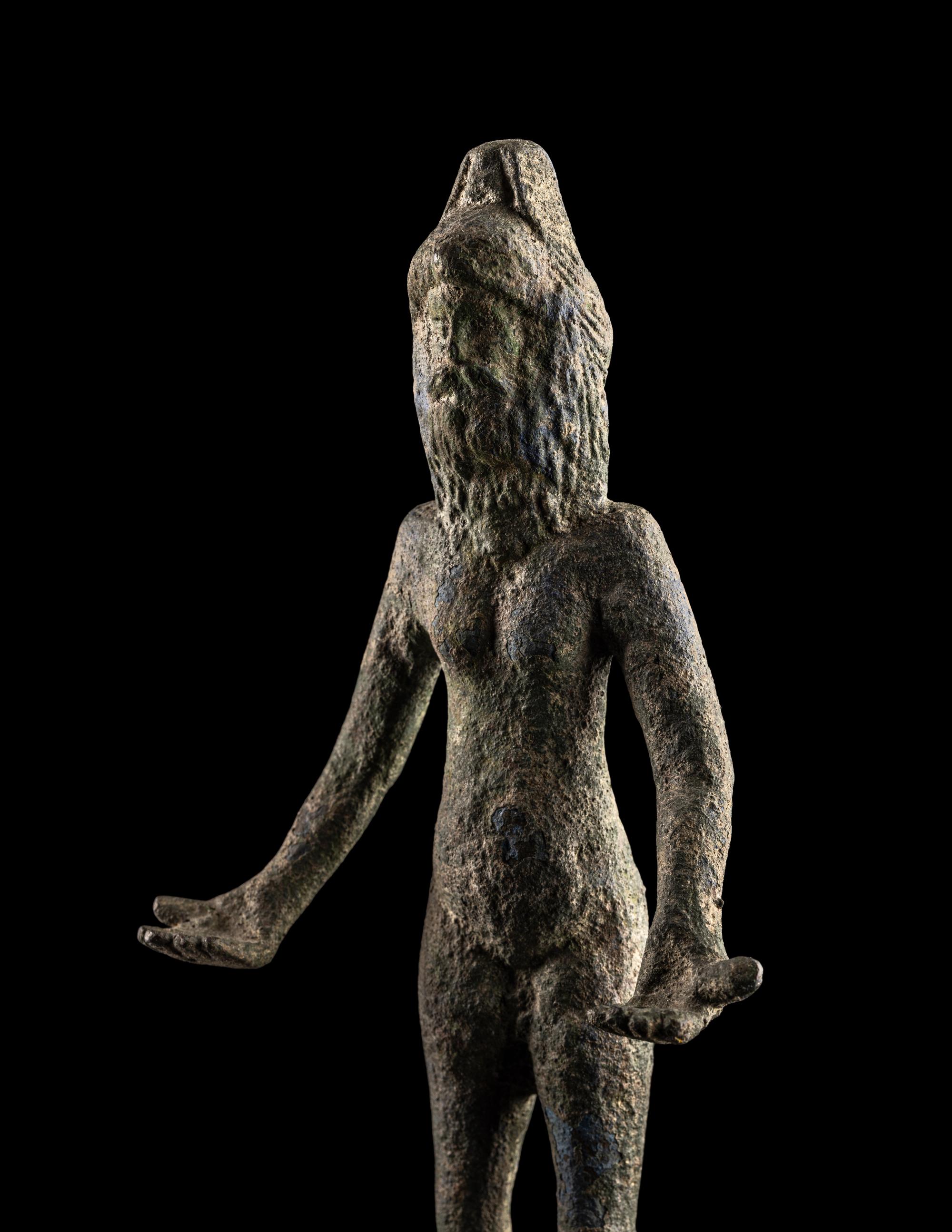 An Etruscan Bronze Female Figure Wearing a Theater Mask