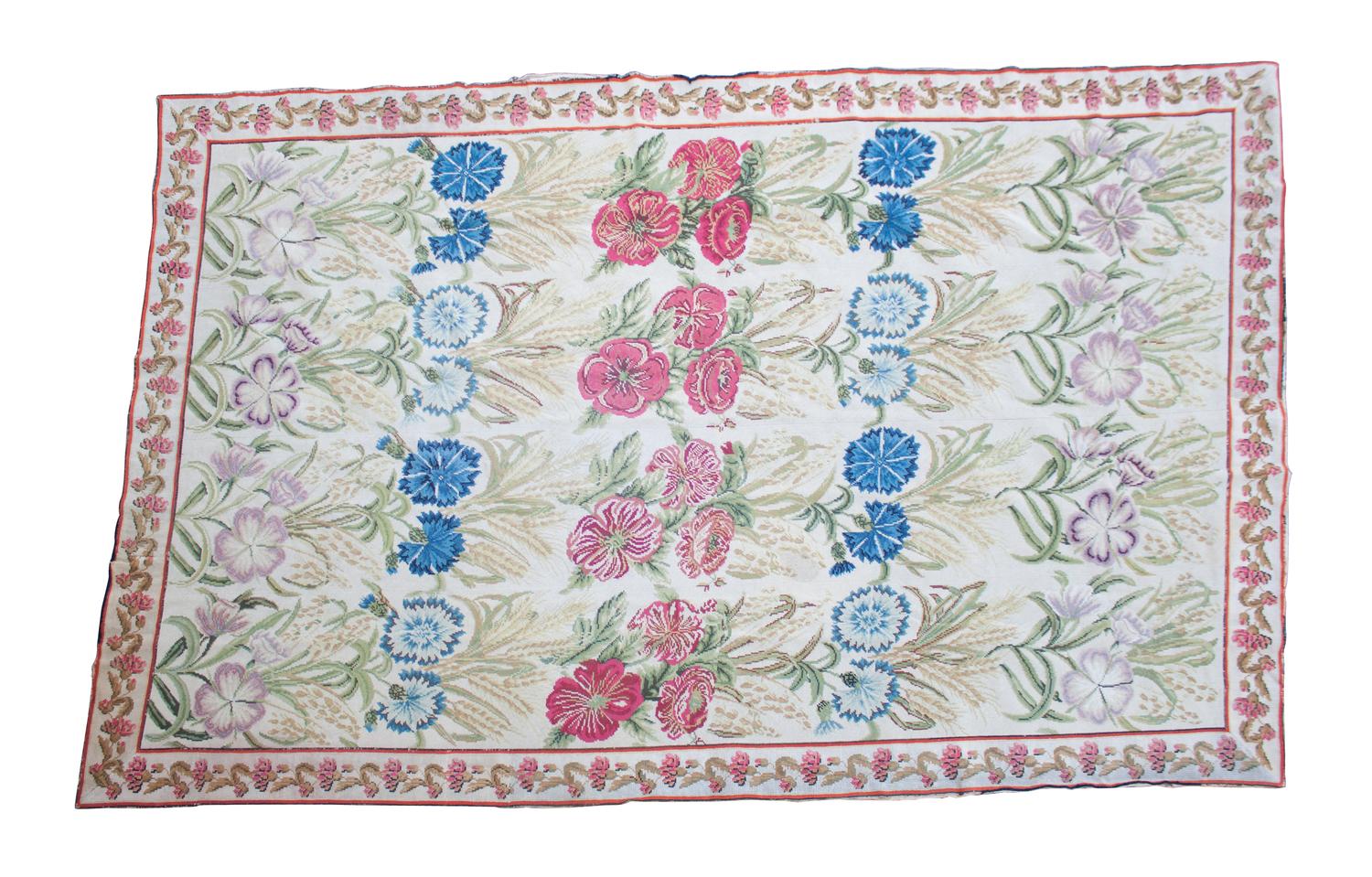 An English Wool Needlework Rug 117 x 77 inches. — 20TH CENTURY