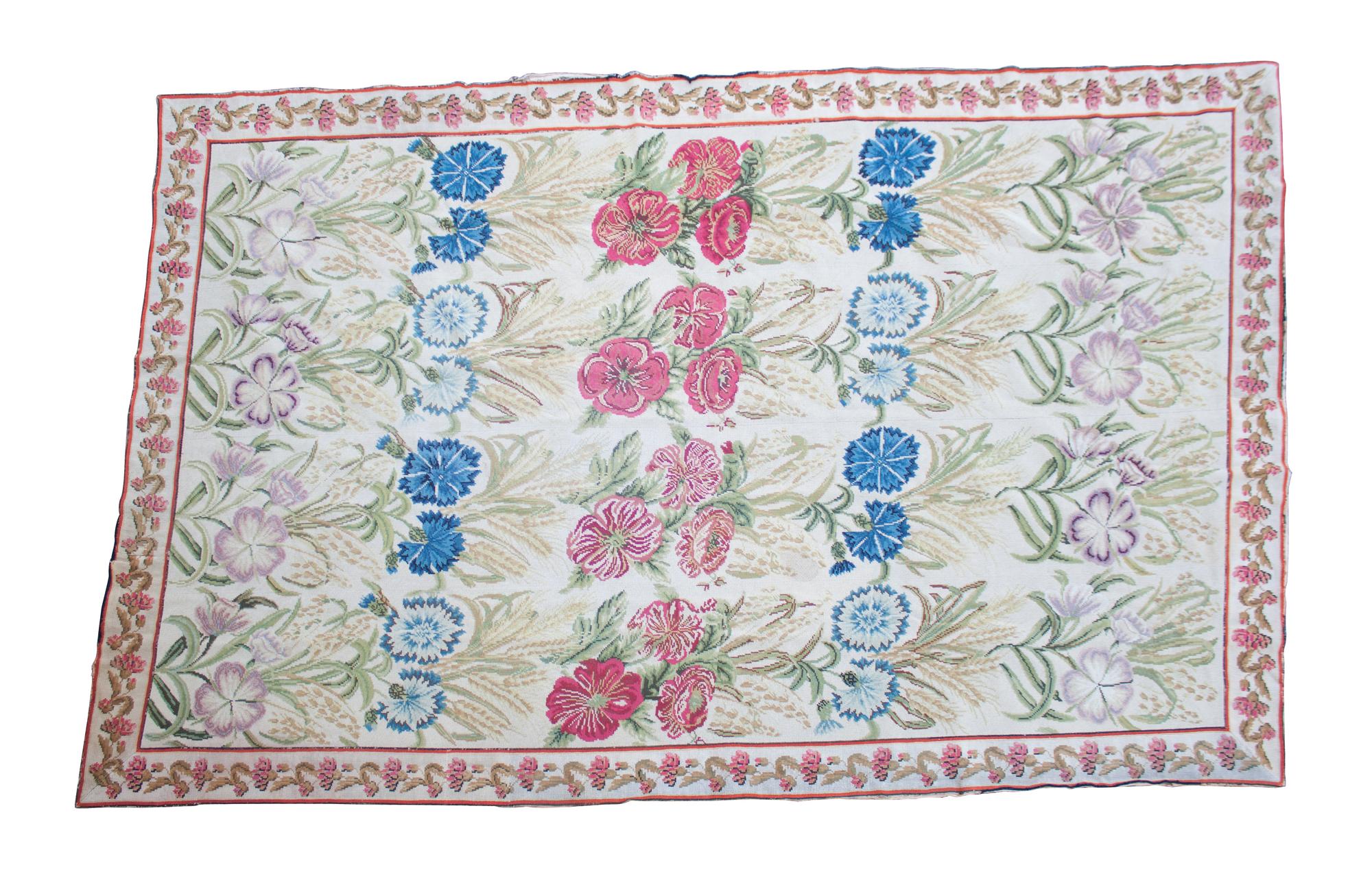 An English Wool Needlework Rug 117 x 77 inches. — 20TH CENTURY