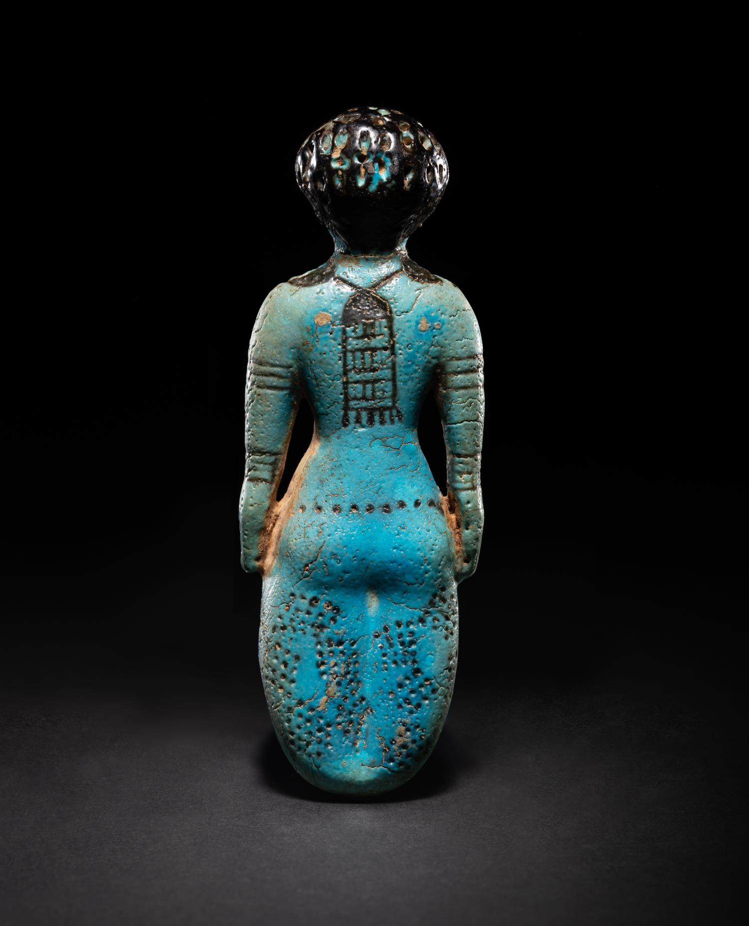 An Egyptian Faience Female Figure
