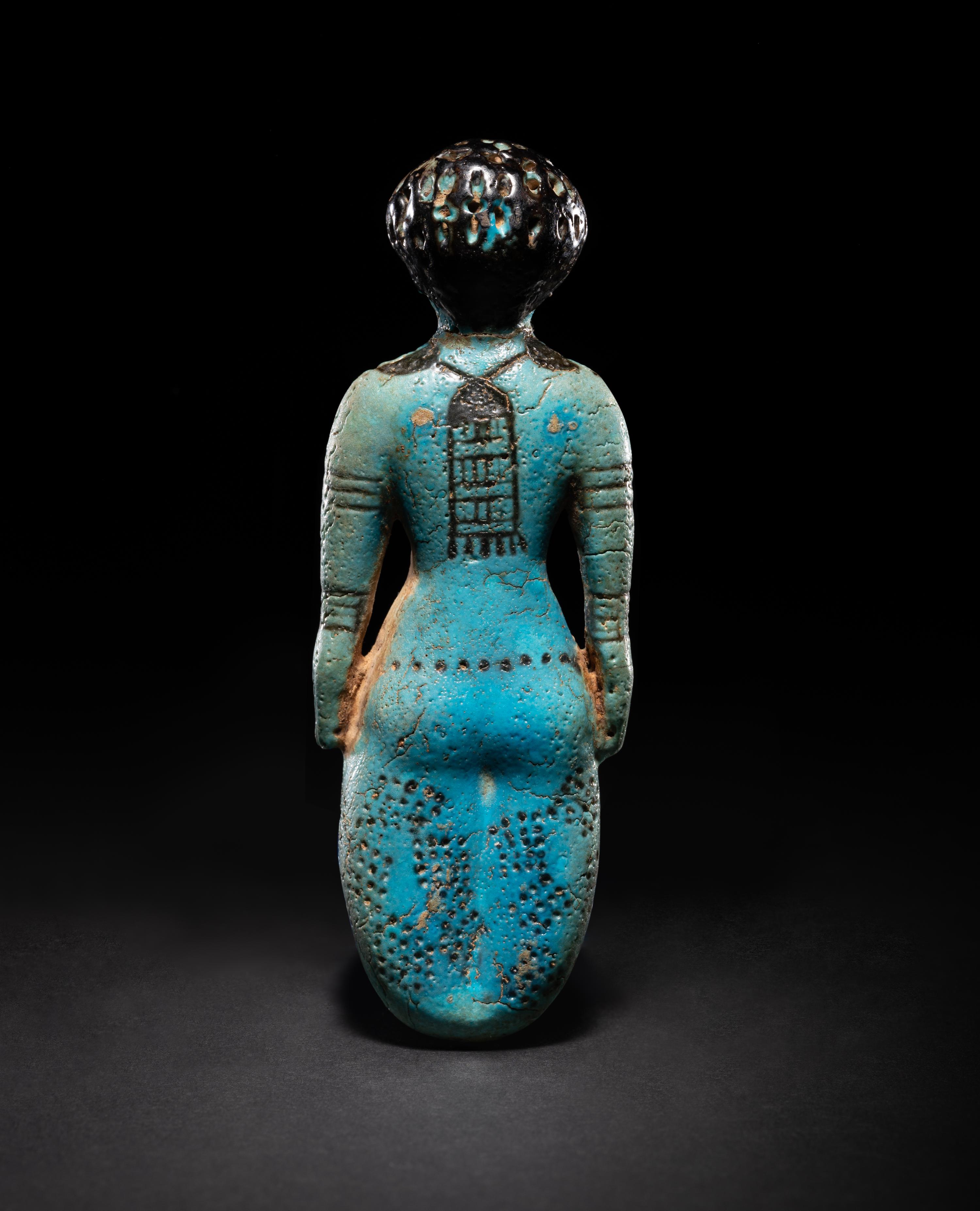 An Egyptian Faience Female Figure