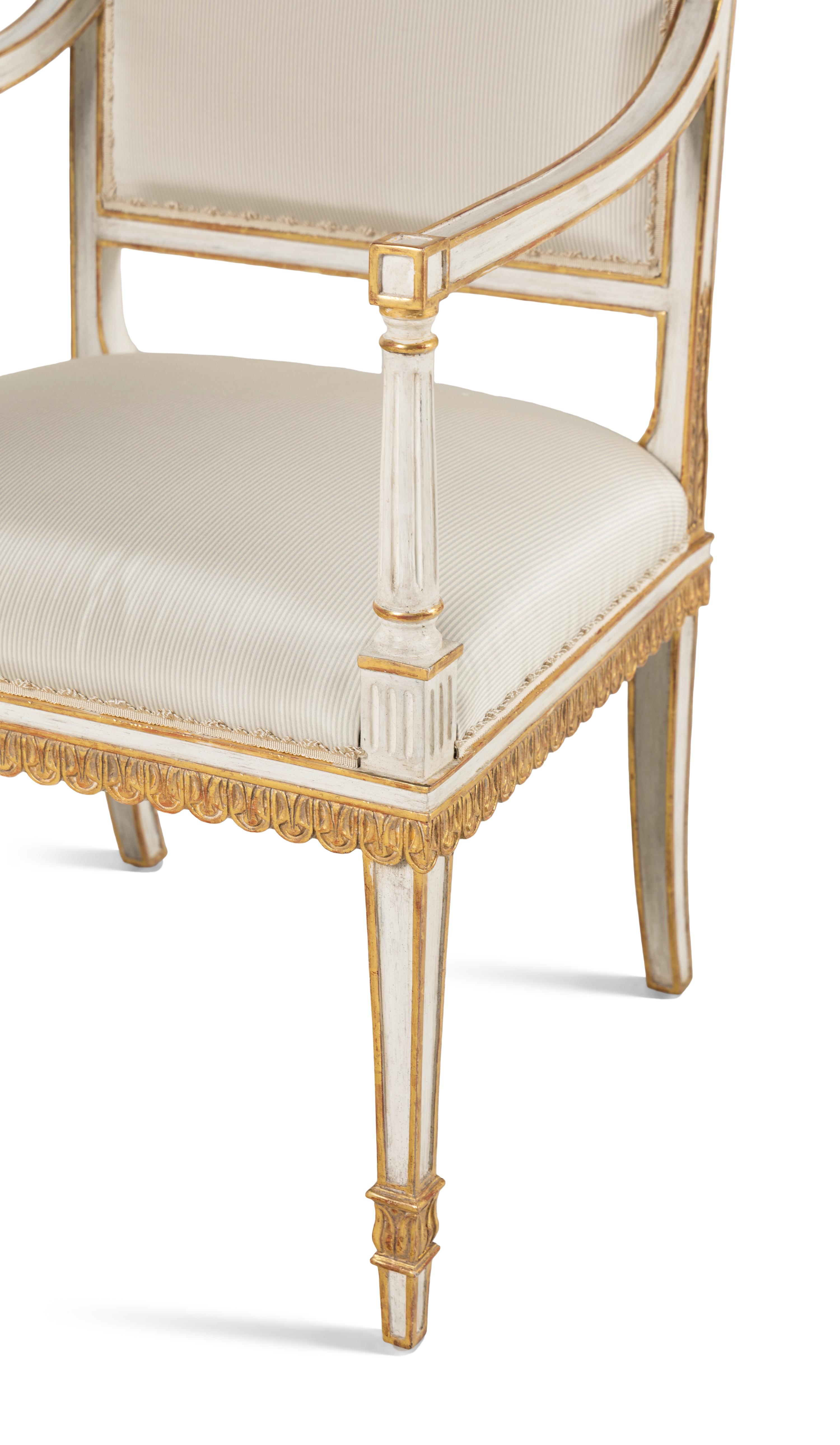 A Pair of Painted and Parcel Gilt Armchairs