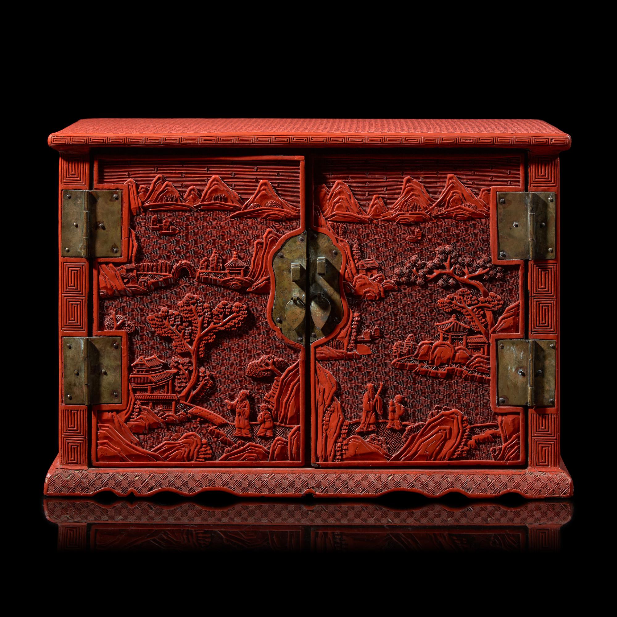A Chinese Carved Cinnabar Lacquer Two-Door Small Cabinet, Late 19th/20th Century 清末民國 剔紅百寶箱