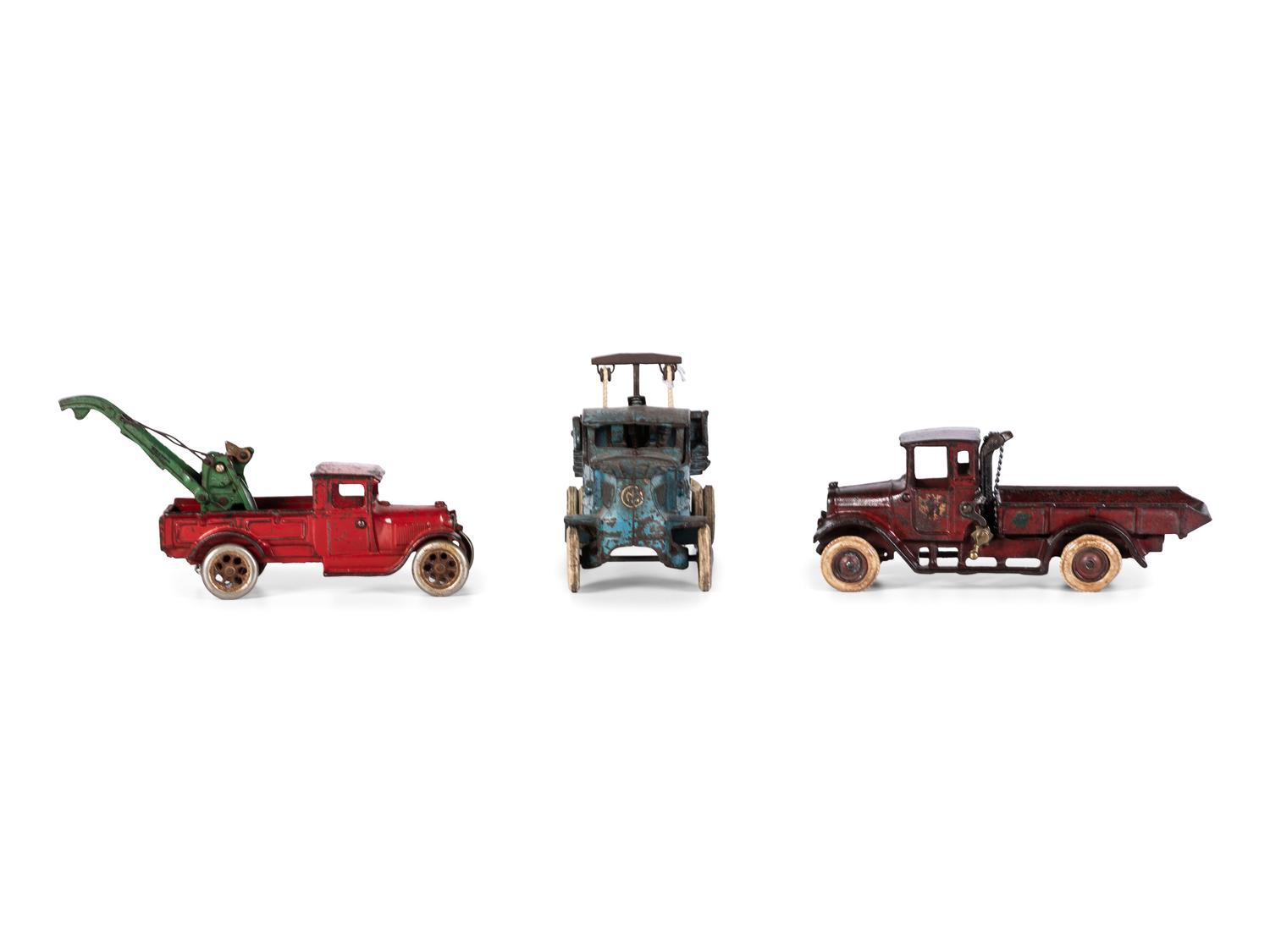 Three Arcade Painted Cast Iron Toy Trucks