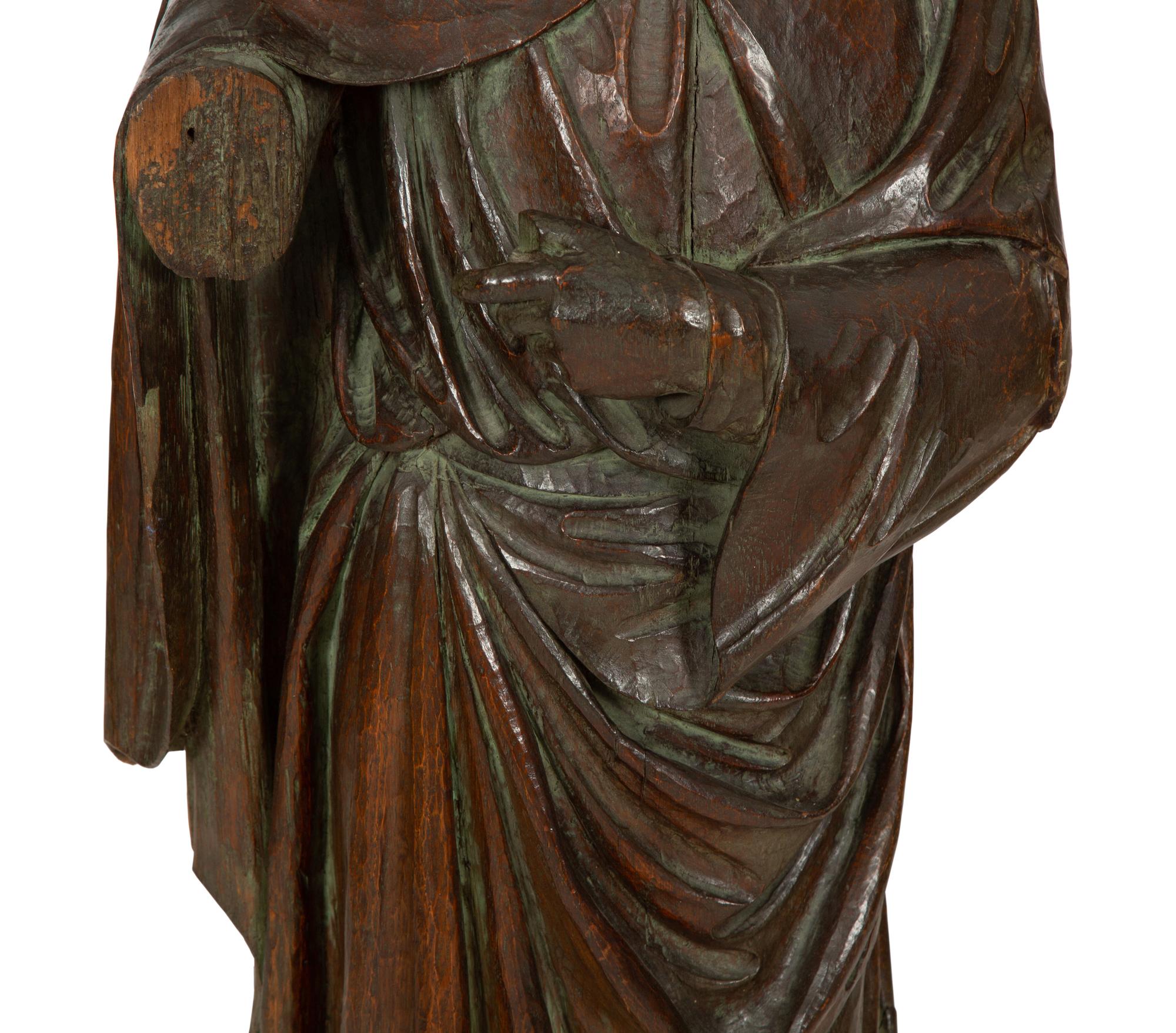 A Continental Carved Oak Figure of a Saint