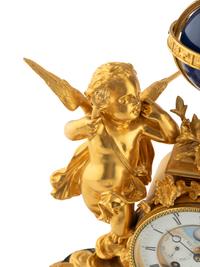 A Continental Gilt Bronze and Marble Figural Mantel Clock