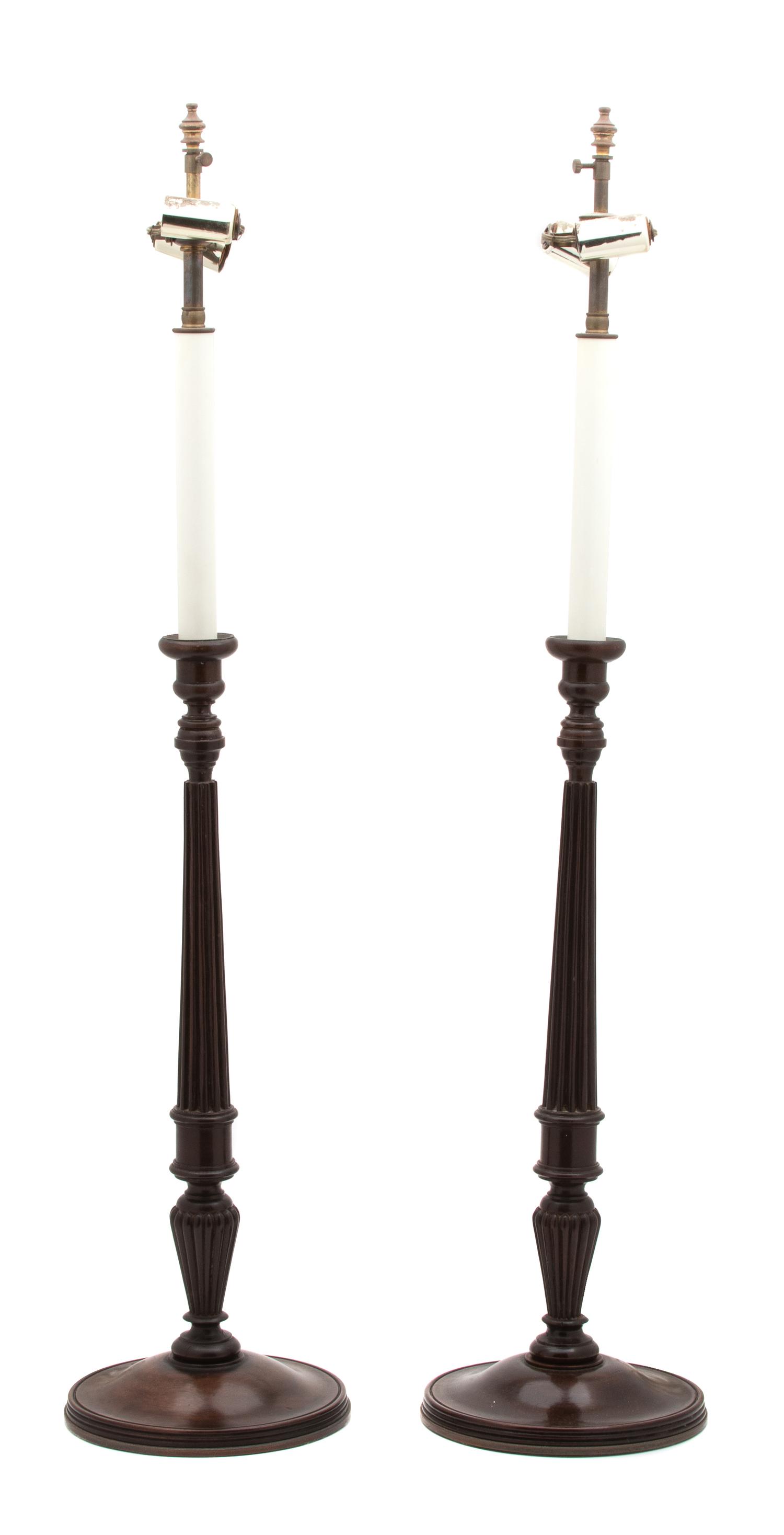 A Pair of English Mahogany Columnar-Form Candlesticks Height overall 34 inches. — 20TH CENTURY