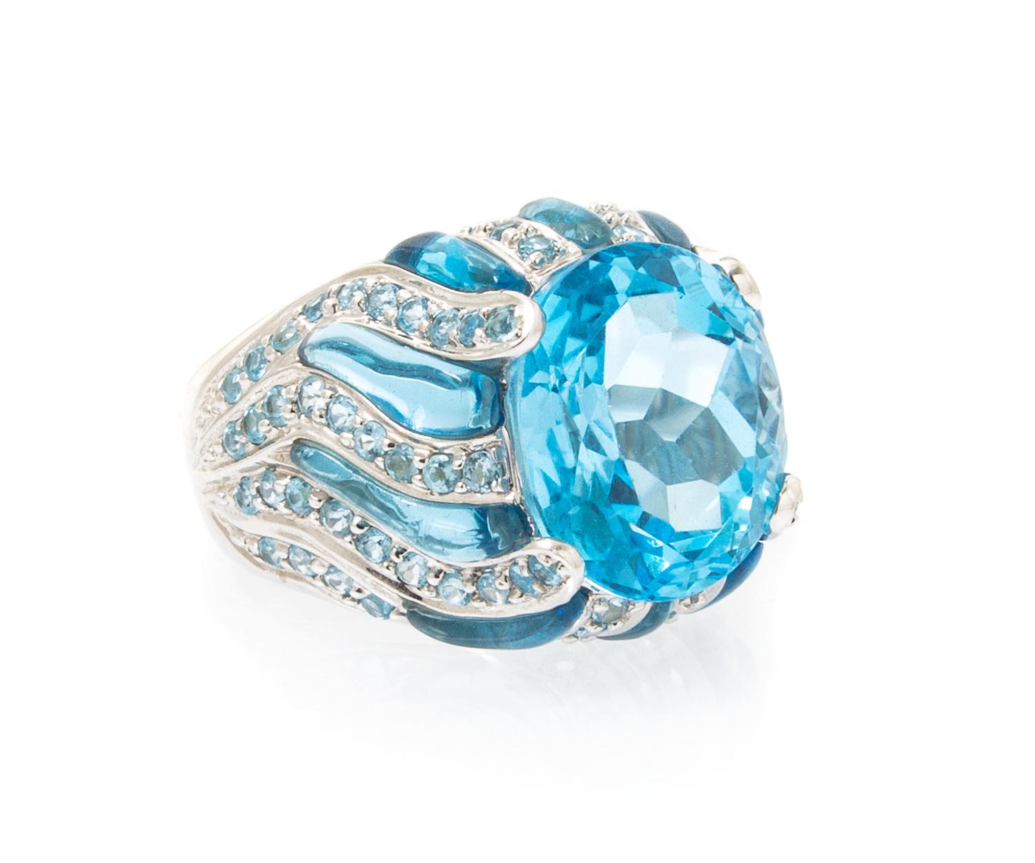 An 18 Karat White Gold and Blue Topaz Ring, 8.20 dwts.
