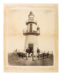 Advertising CHICKERING, Elmer (1857-1915), photographer. Advertisement photograph featuring the Worcester Salt Co. lighthouse display at the Boston Food Fair. Boston, MA: 1897.