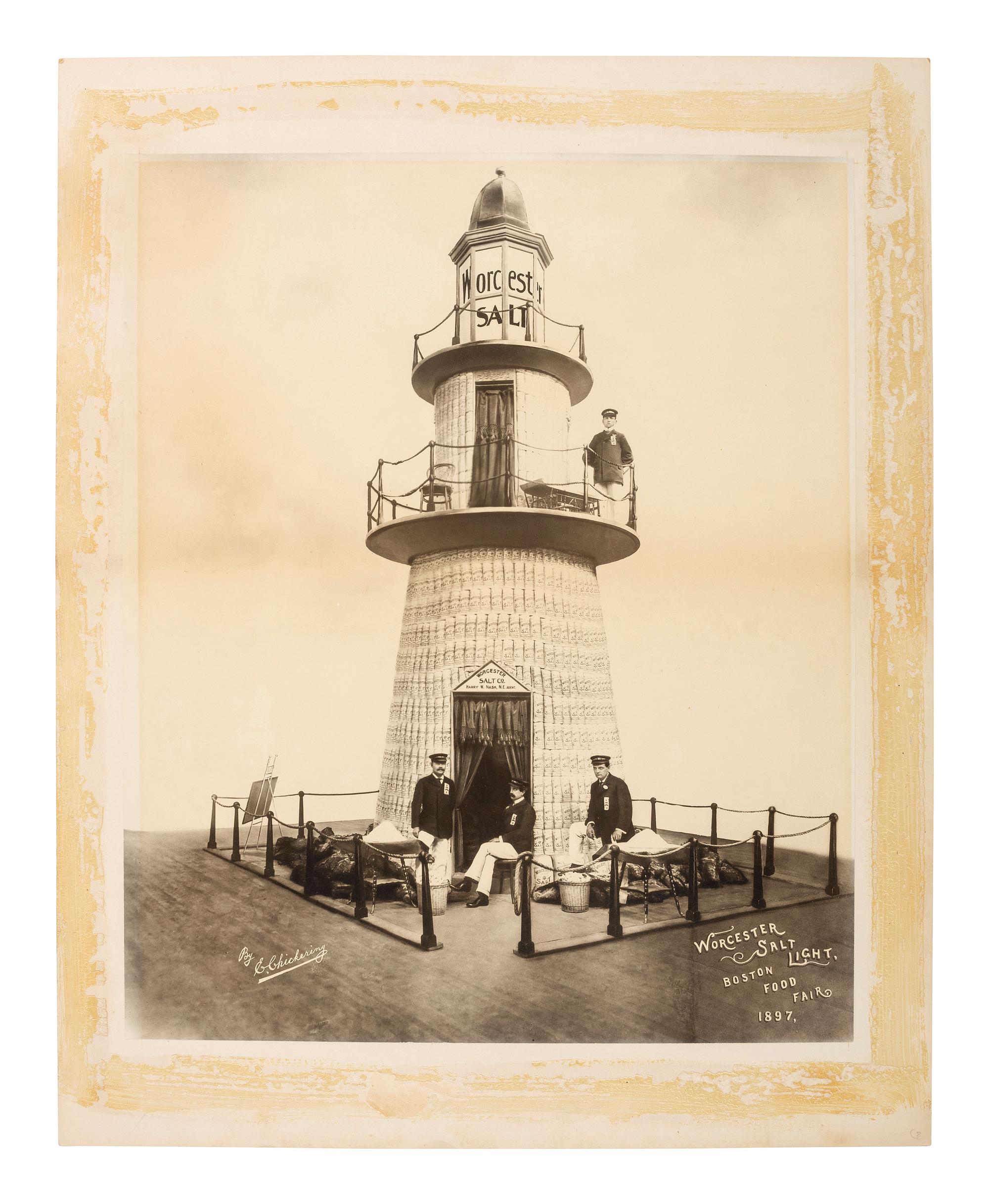 Advertising CHICKERING, Elmer (1857-1915), photographer. Advertisement photograph featuring the Worcester Salt Co. lighthouse display at the Boston Food Fair. Boston, MA: 1897.