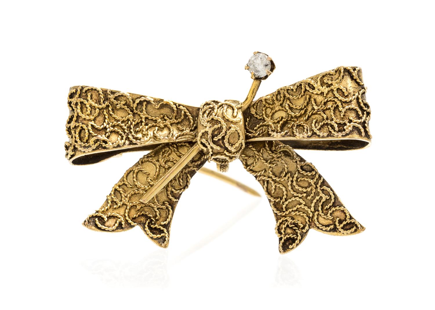A Vintage Yellow Gold and Diamond Bow Brooch, 3.40 dwts.