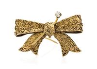 A Vintage Yellow Gold and Diamond Bow Brooch, 3.40 dwts.