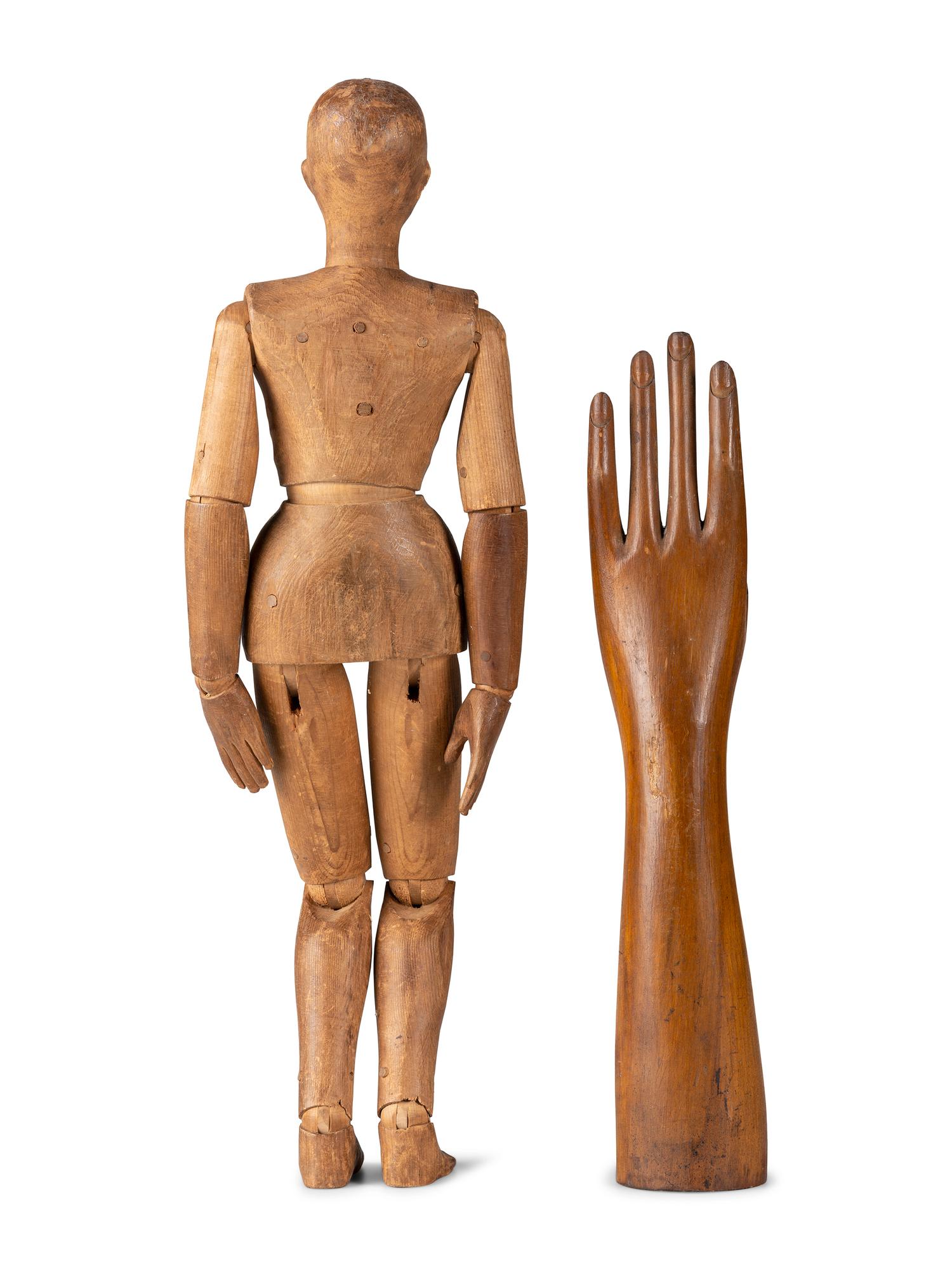 An Articulated Wooden Mannequin and a Carved Wooden Hand with Articulated Thumb