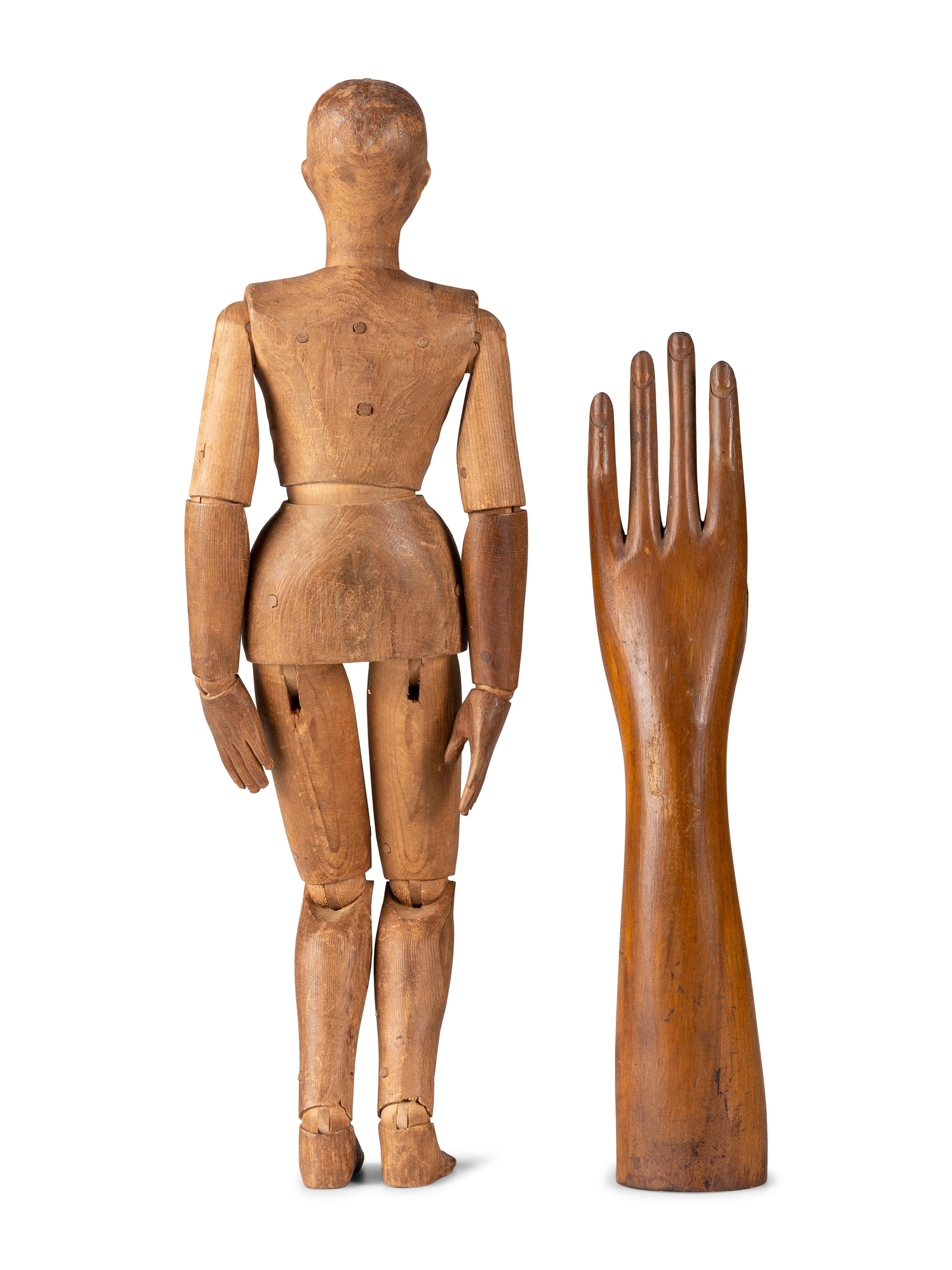 An Articulated Wooden Mannequin and a Carved Wooden Hand with Articulated Thumb