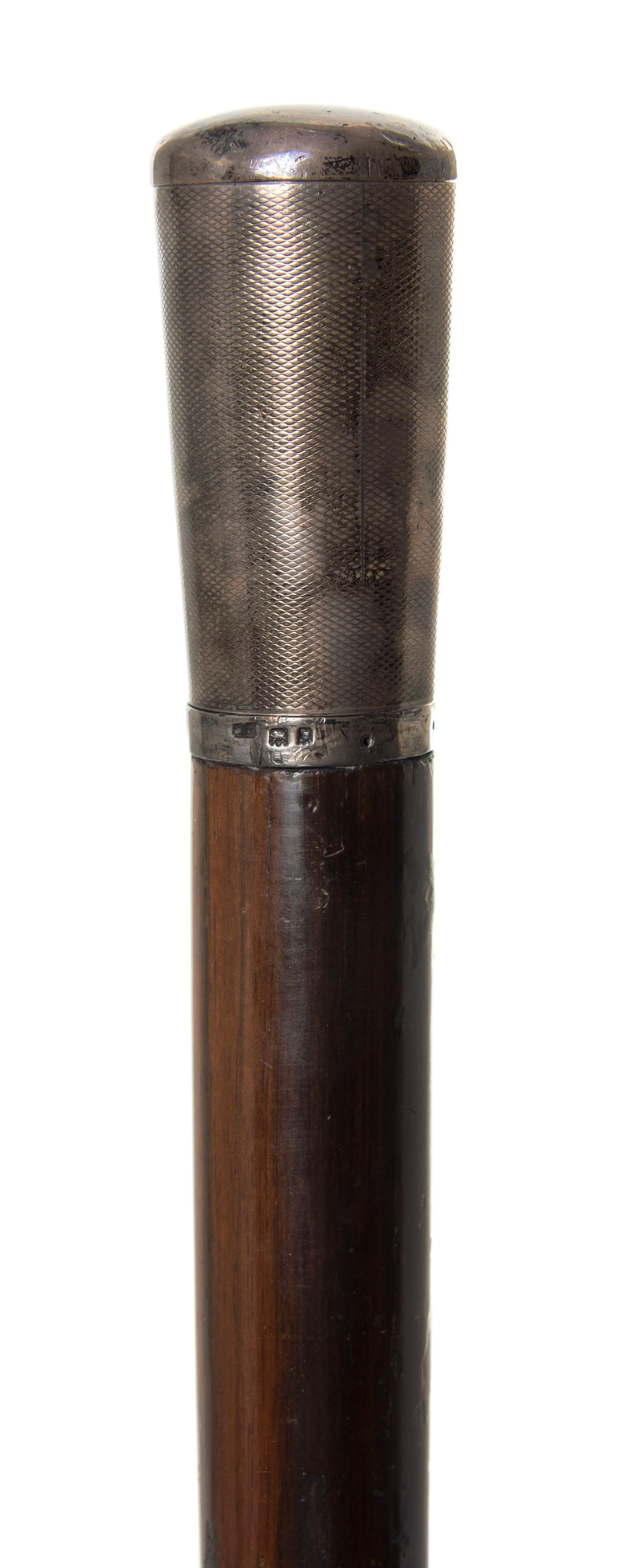 An English Tipping Handled Walking Stick, Length of handle 2 1/2 x length overall 36 1/2 inches.