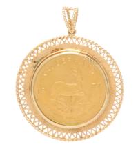 A 14 Karat Yellow Gold and South African Krugerrand Gold Coin Pendant, 29.20 dwts.