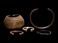 Five African Metalwork Currency Bracelets