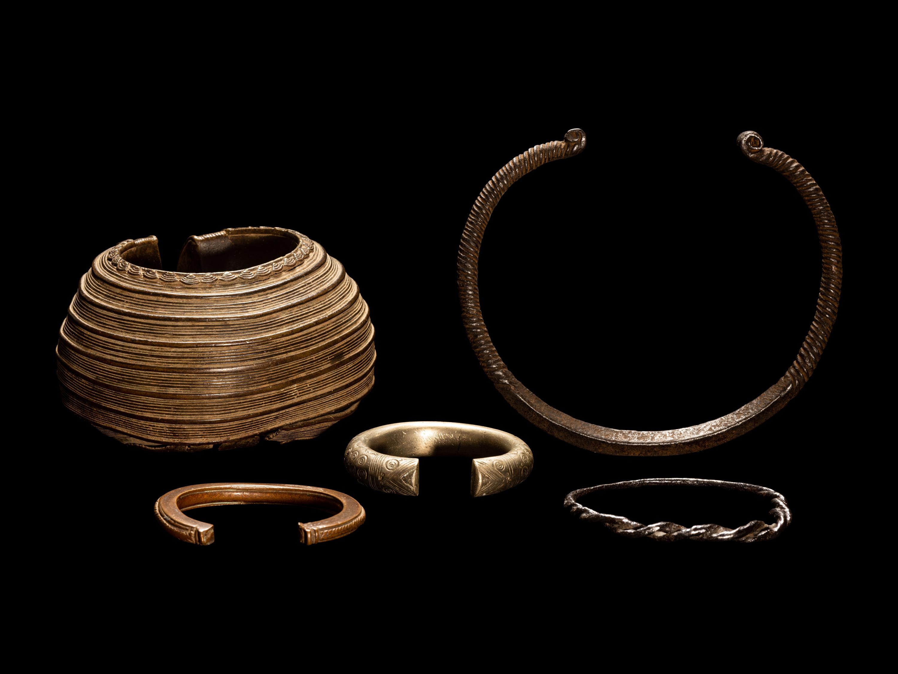 Five African Metalwork Currency Bracelets