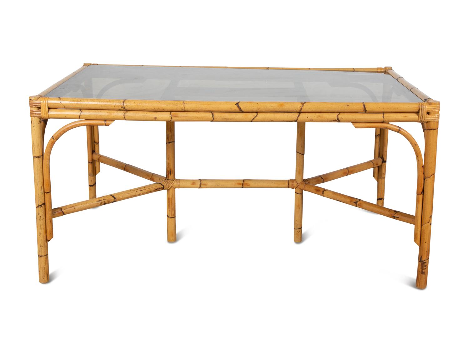 A Bamboo and Rattan Dining Set comprising a table and six chairs.